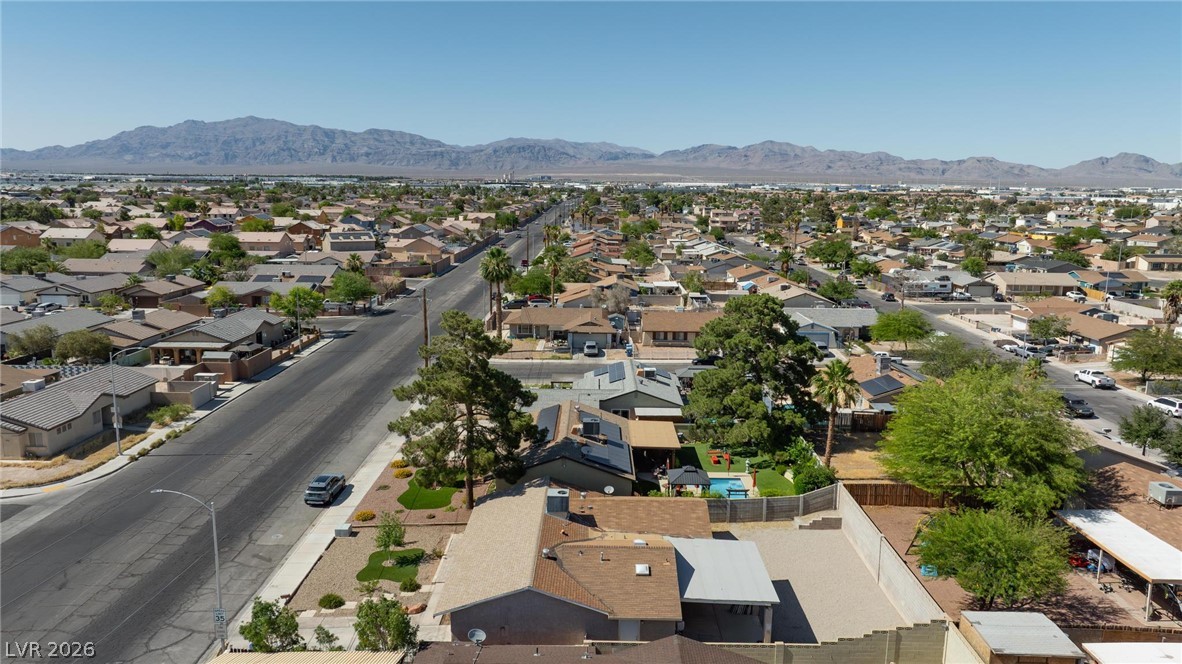 3640 North Walnut Road Las Vegas, NV 89115 - Photo 36 of 38 An aerial perspective reveals a residential community nestled against a distant mountain range.