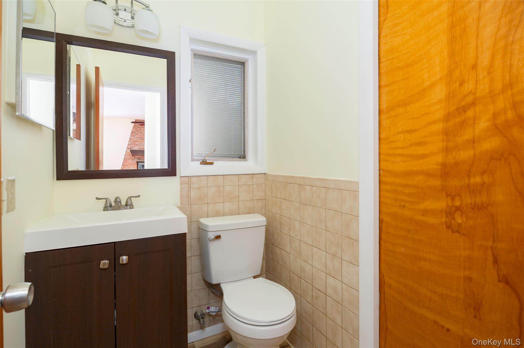303 Freedom Road Pleasant Valley, NY 12569 - Photo 12 of 40 a bathroom with a toilet a sink and mirror