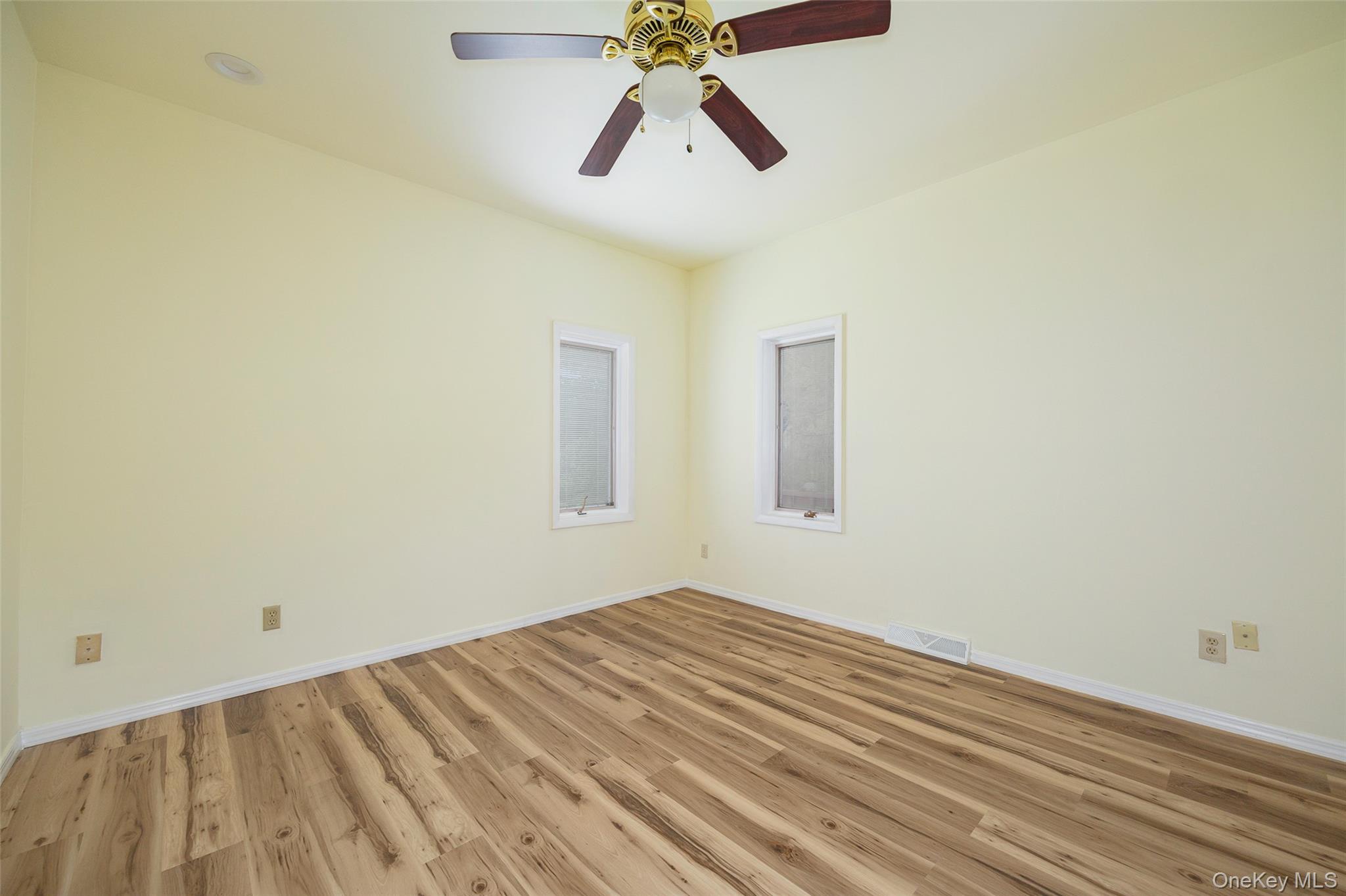 303 Freedom Road Pleasant Valley, NY 12569 - Photo 13 of 40 a view of room with wooden floor and ceiling fan