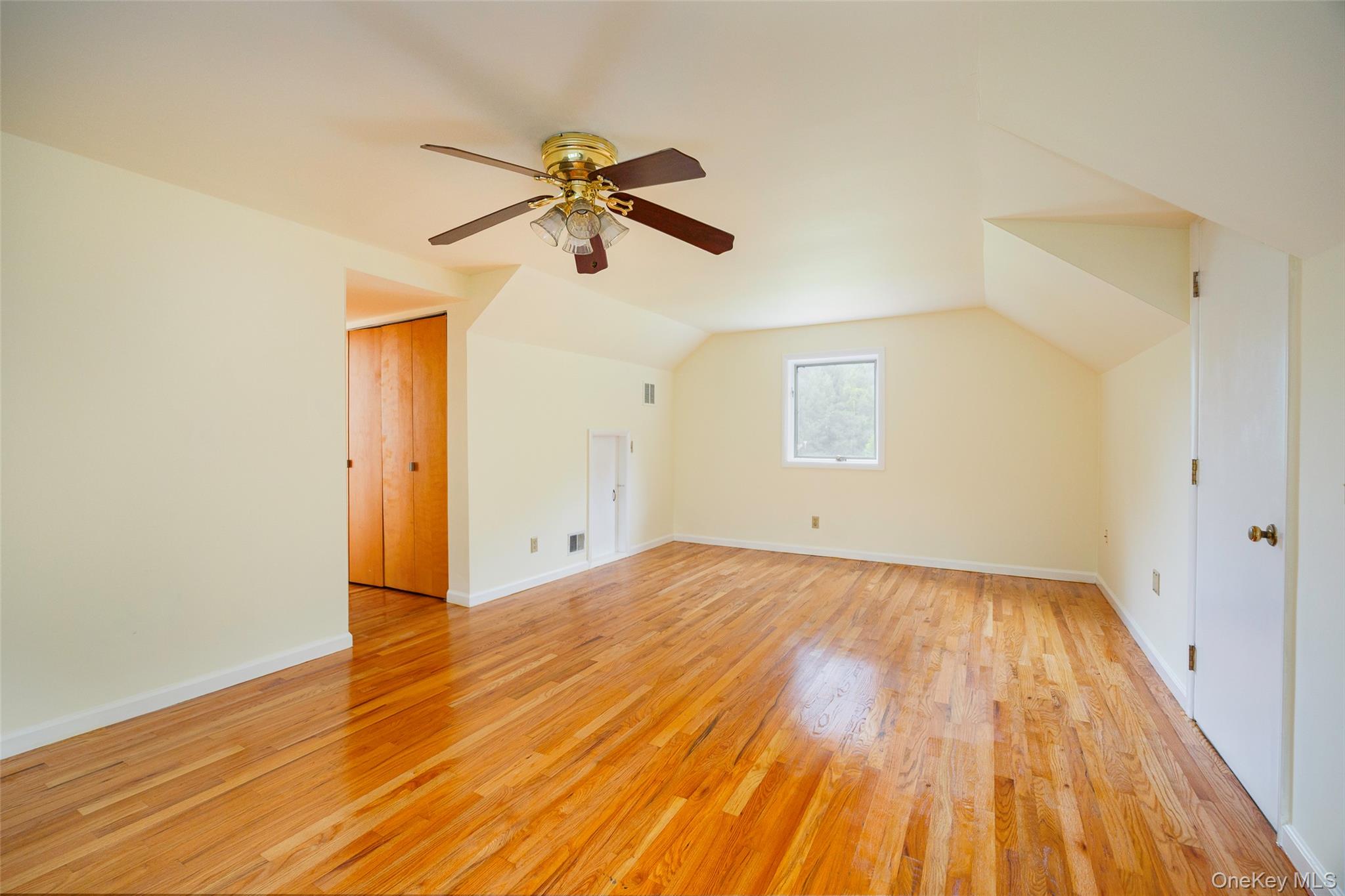303 Freedom Road Pleasant Valley, NY 12569 - Photo 18 of 40 a view of empty room with wooden floor and fan