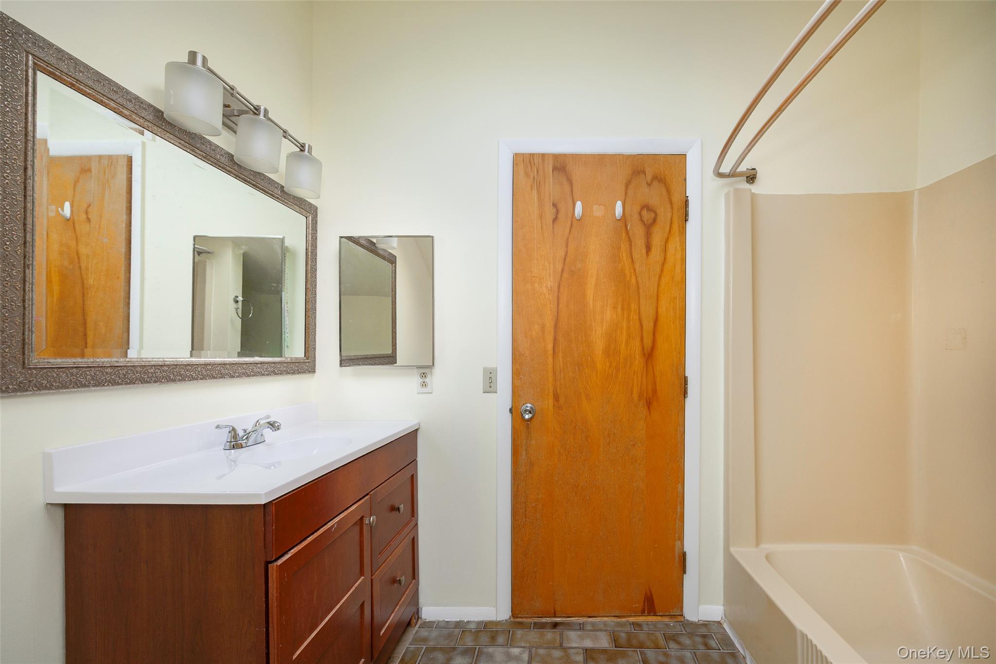 303 Freedom Road Pleasant Valley, NY 12569 - Photo 19 of 40 a bathroom with a sink and a mirror