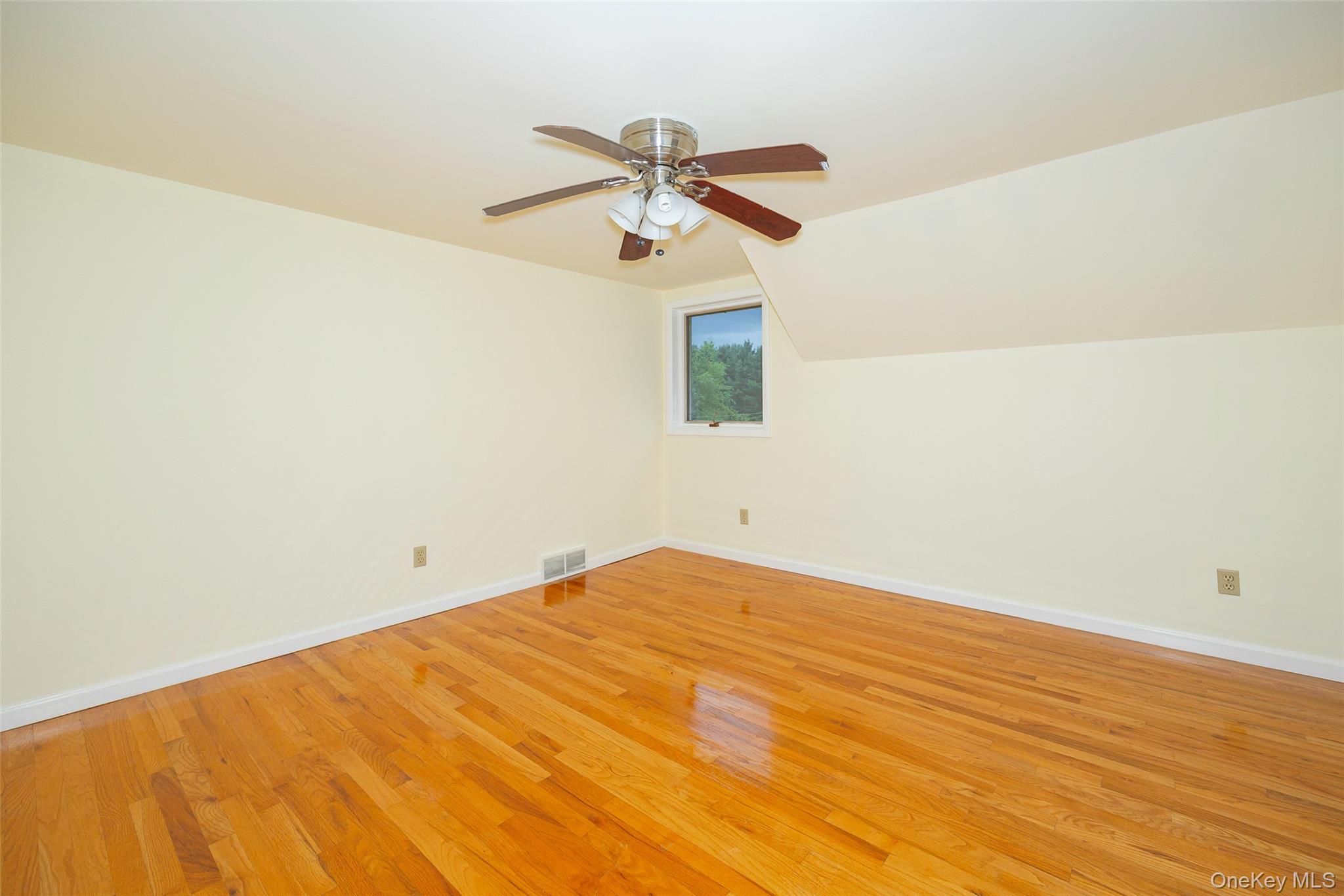 303 Freedom Road Pleasant Valley, NY 12569 - Photo 20 of 40 a view of a room with wooden floor and a ceiling fan