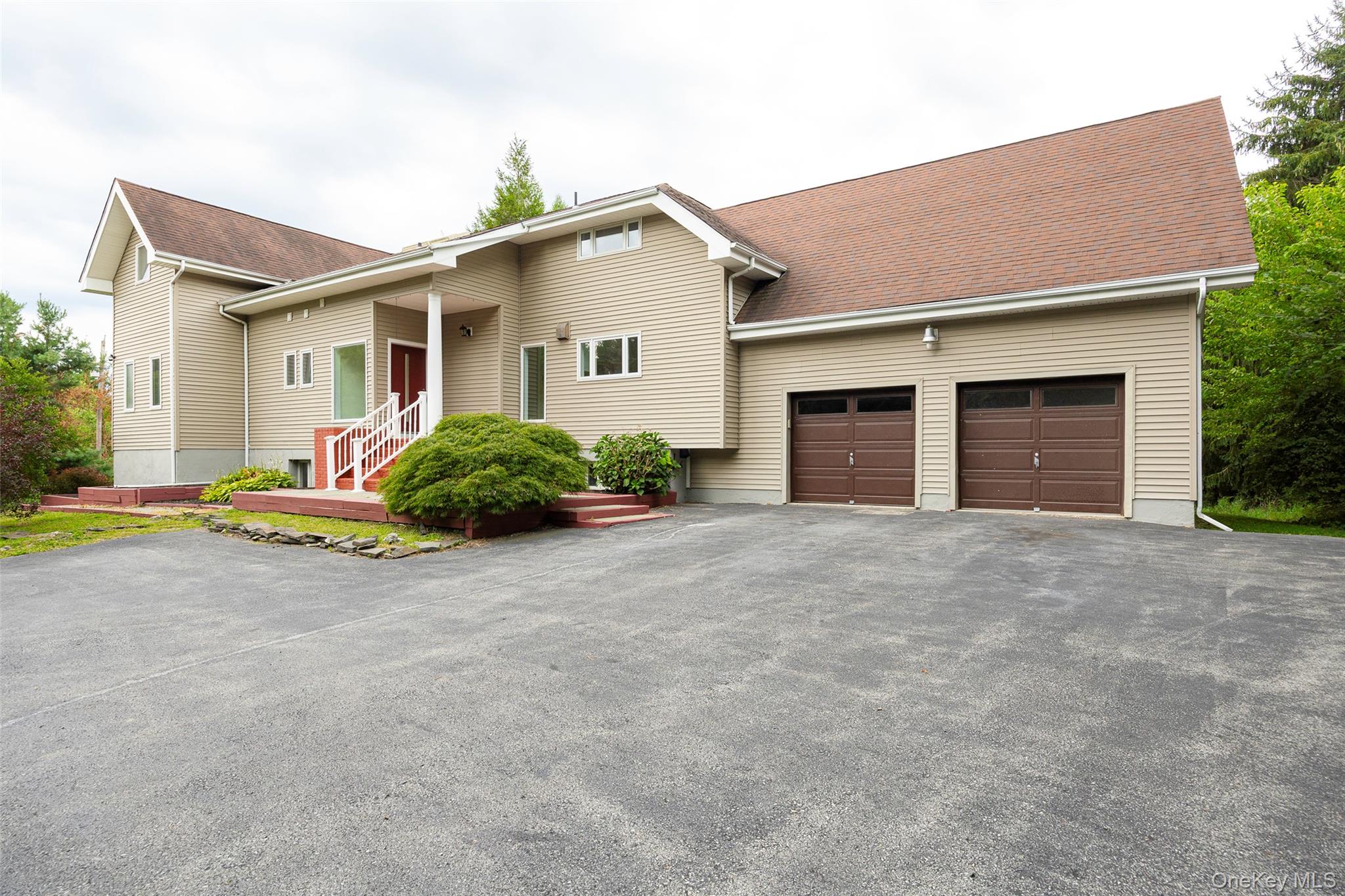 303 Freedom Road Pleasant Valley, NY 12569 - Photo 2 of 40 a view of a house with a yard and garage