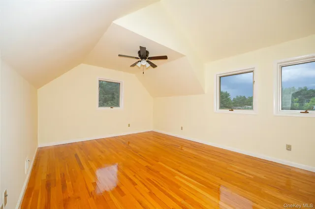 a view of a room with a wooden floor