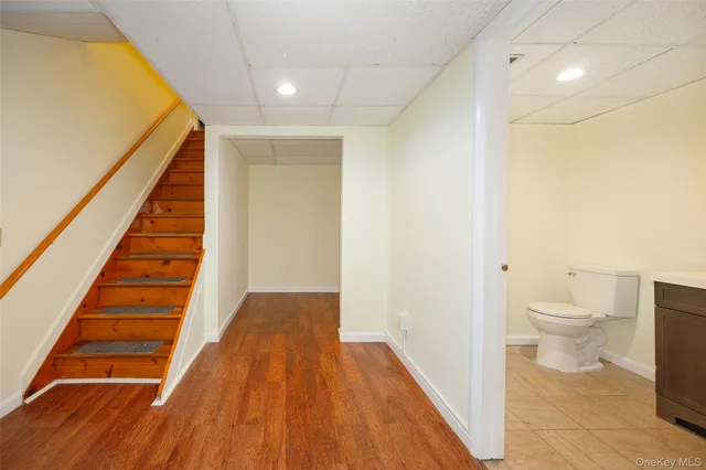 a view of a livingroom with furniture nad wooden floor