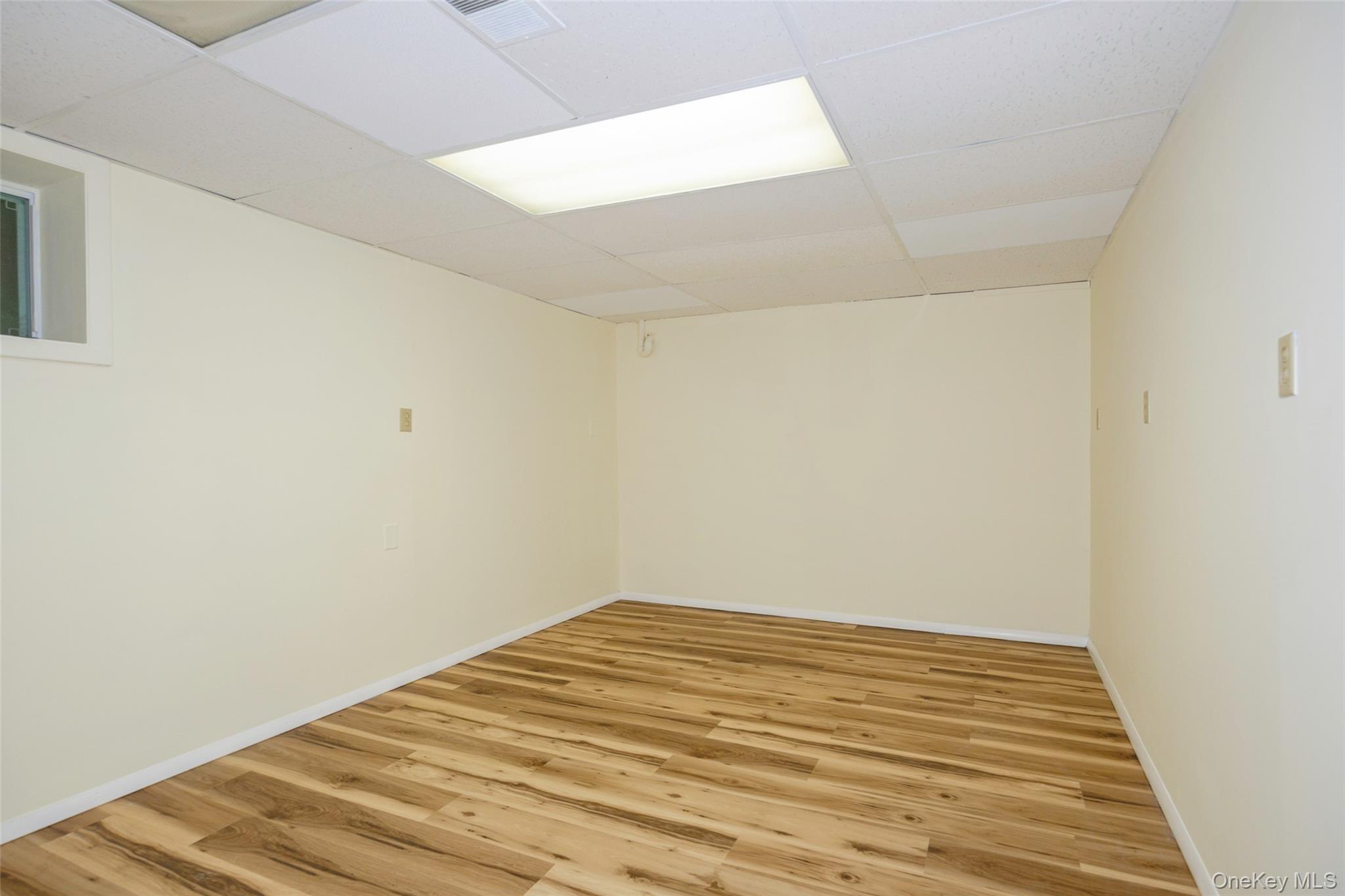 303 Freedom Road Pleasant Valley, NY 12569 - Photo 29 of 40 a view of a room with wooden floor and white walls