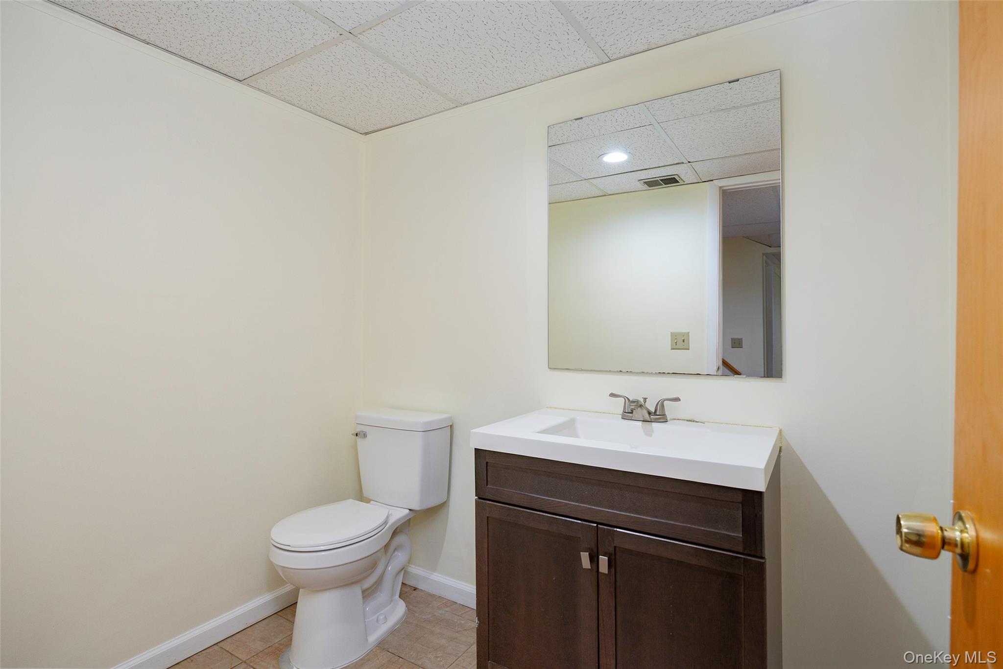 303 Freedom Road Pleasant Valley, NY 12569 - Photo 31 of 40 a bathroom with a sink vanity and a toilet