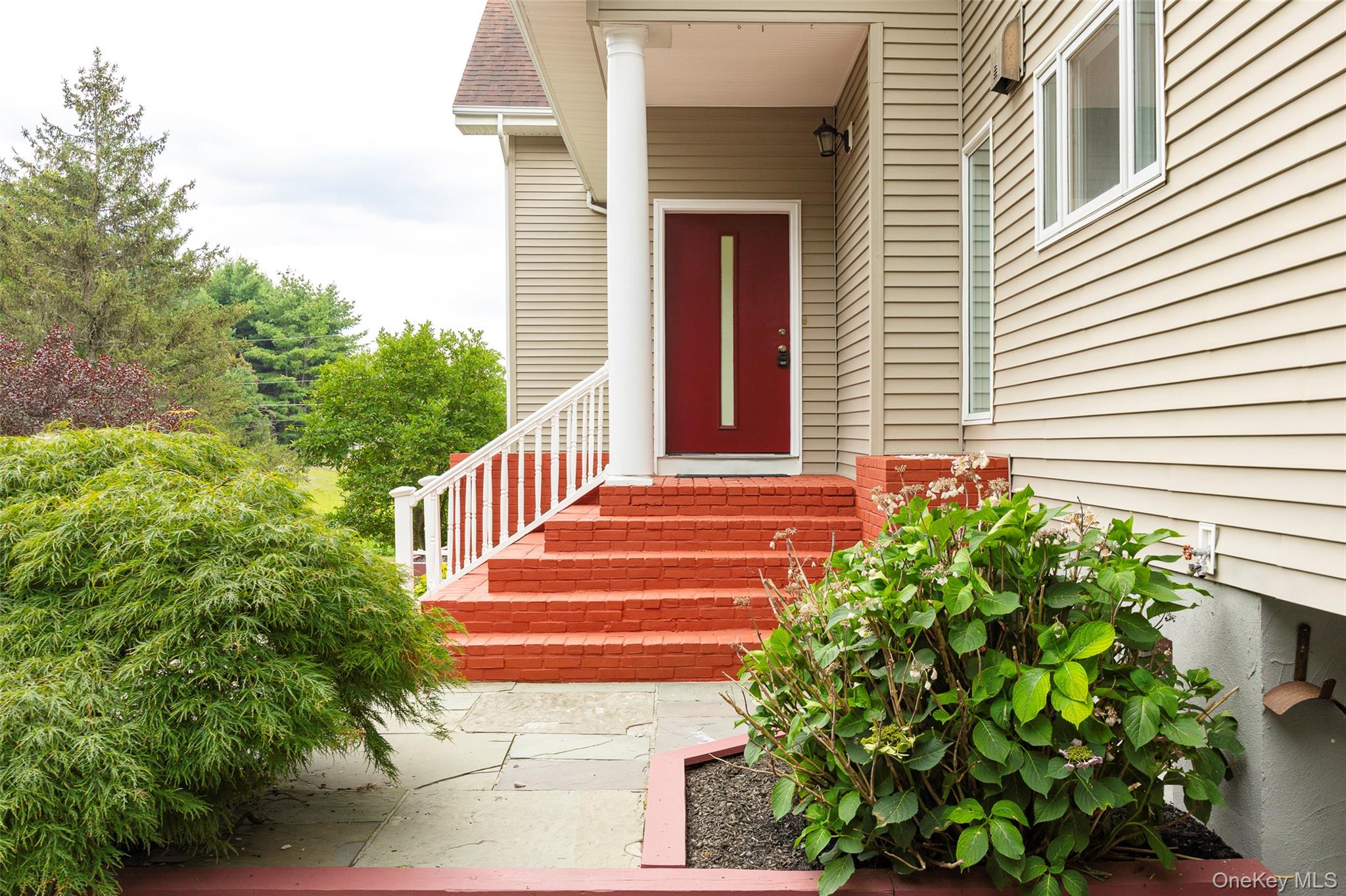 303 Freedom Road Pleasant Valley, NY 12569 - Photo 36 of 40 a front view of a house with plants and garden