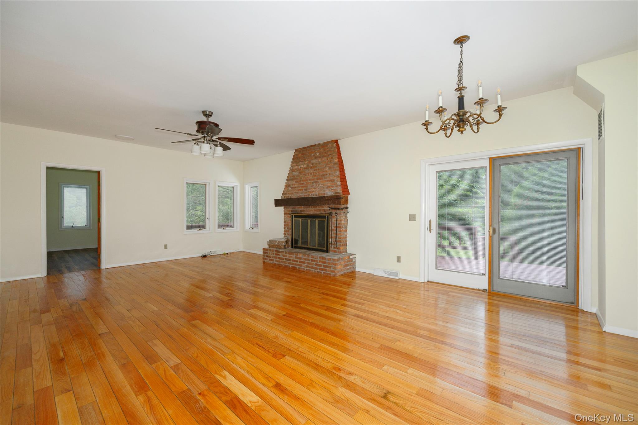 303 Freedom Road Pleasant Valley, NY 12569 - Photo 6 of 40 a view of empty room with wooden floor and fan