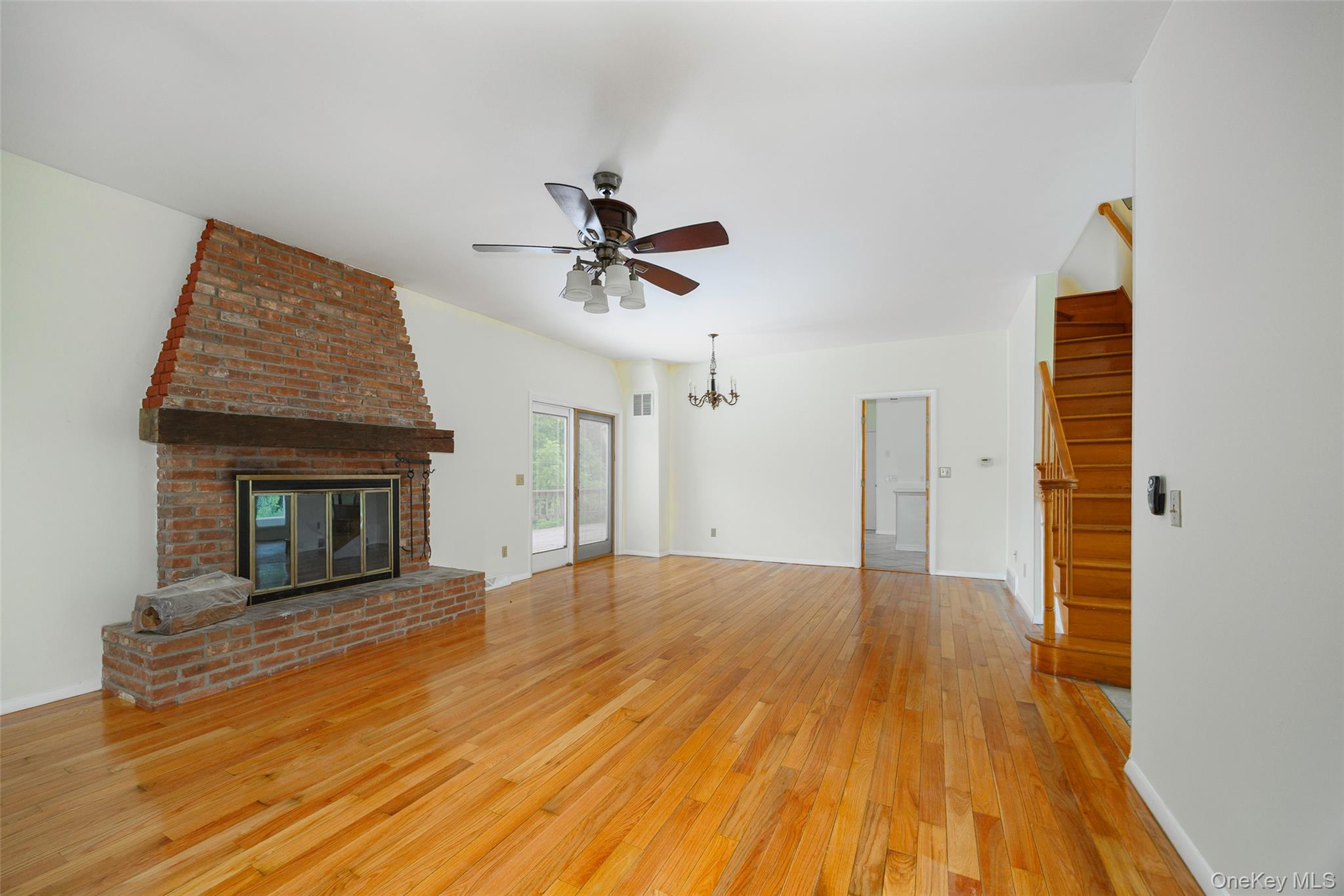 303 Freedom Road Pleasant Valley, NY 12569 - Photo 7 of 40 wooden floor in an empty room with a fireplace