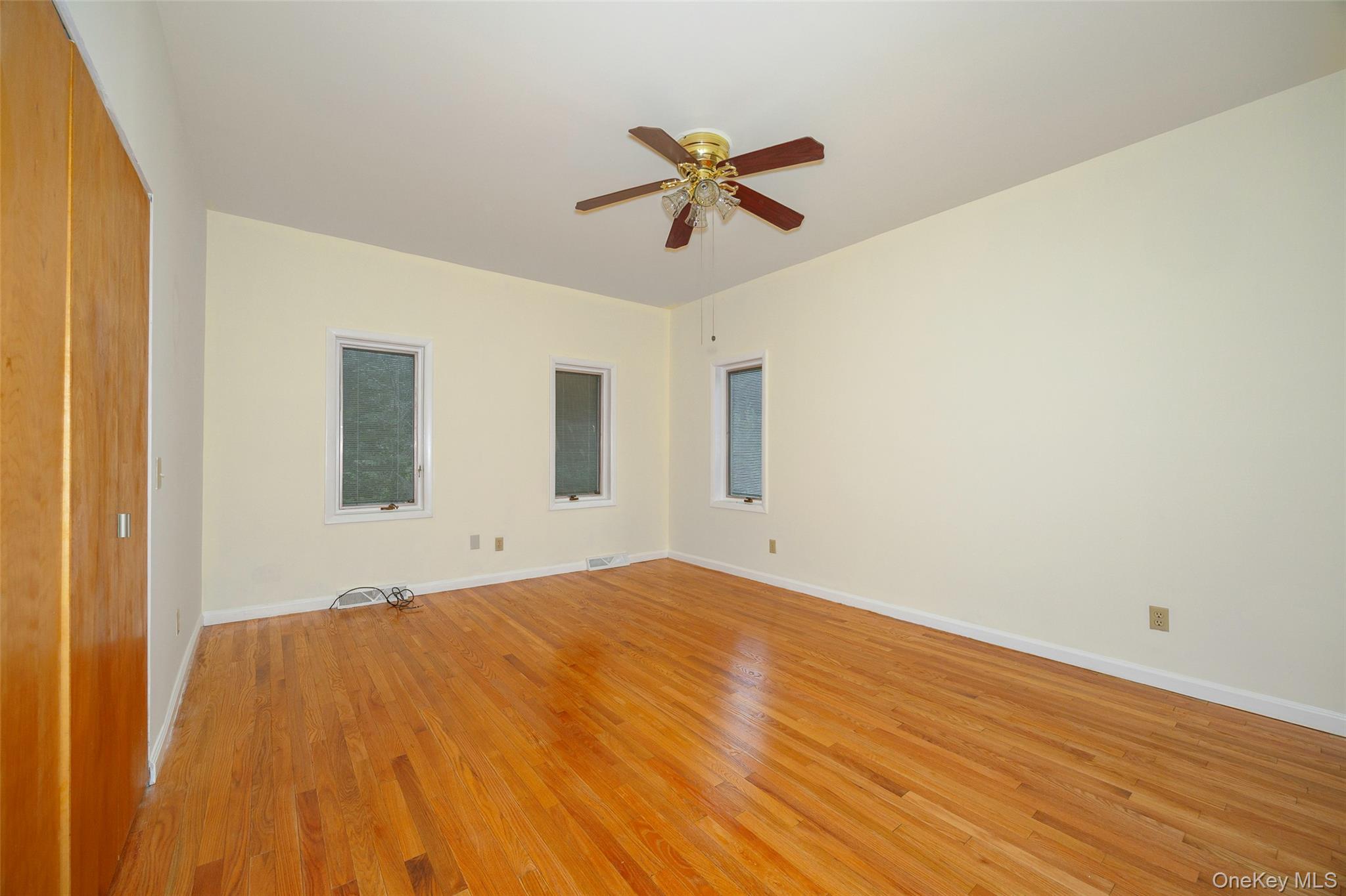303 Freedom Road Pleasant Valley, NY 12569 - Photo 8 of 40 a view of a big room with wooden floor and windows