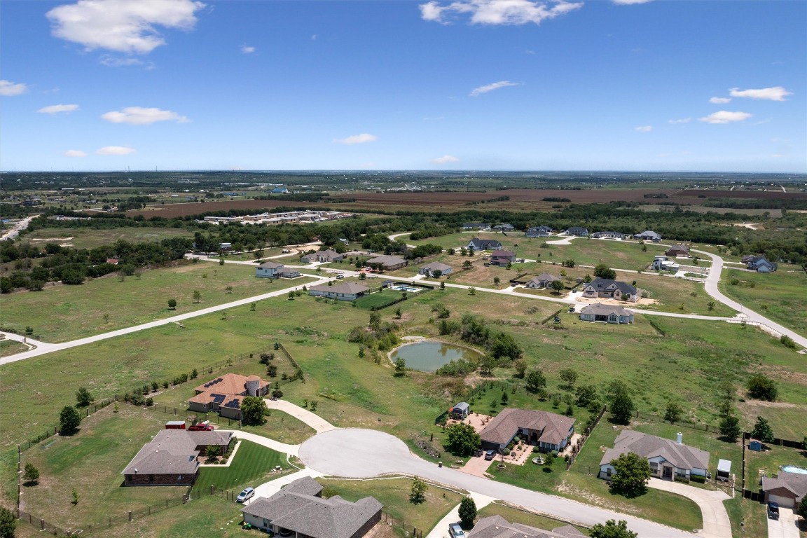 272 Gable Street Kyle, TX 78640 - Photo 5 of 20 SE Aerial Shot of community with available lot in the front of pond.