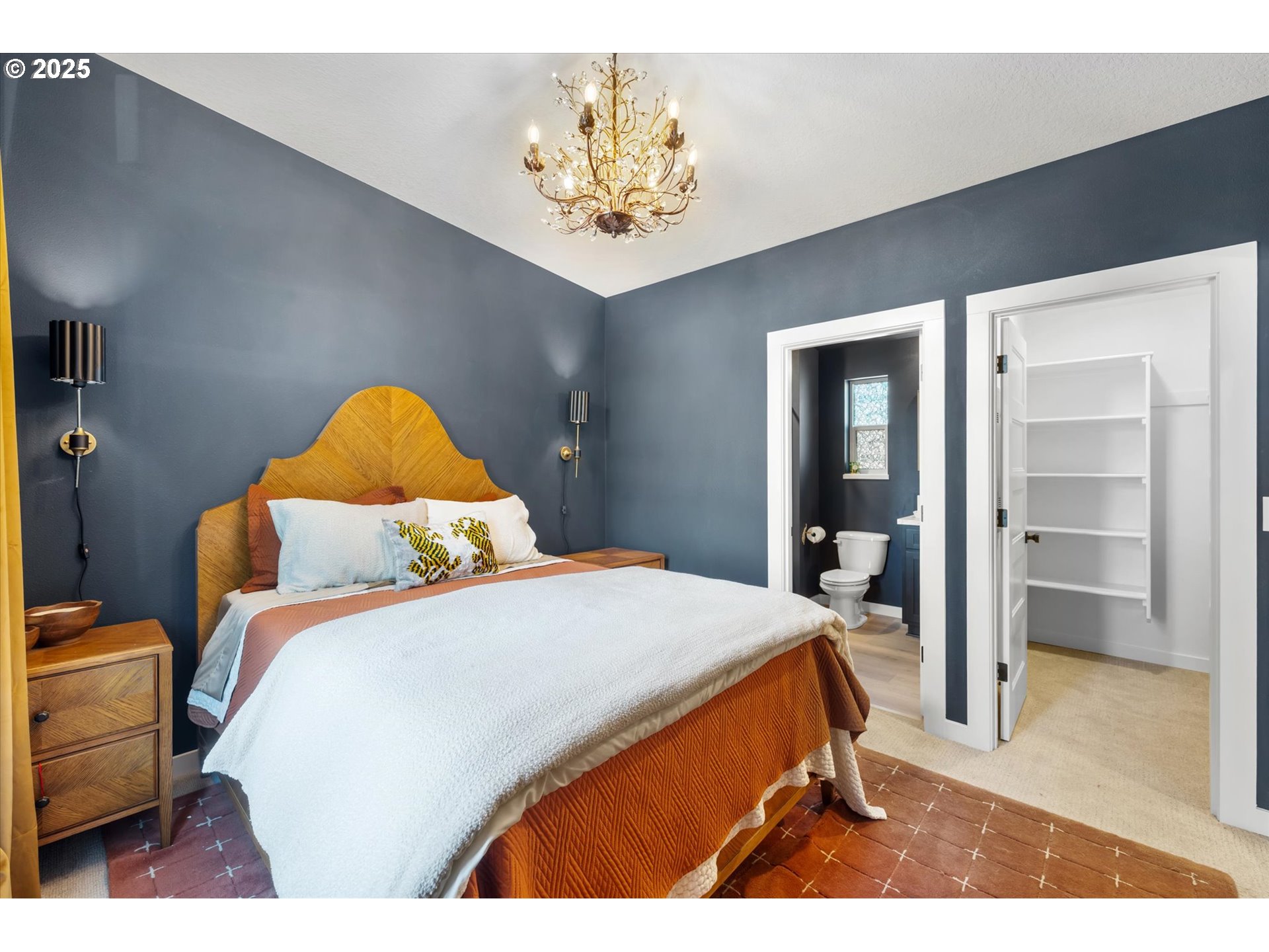 810 Taylor Road Kalama, WA 98625 - Photo 14 of 35 a bedroom with a bed and a chandelier