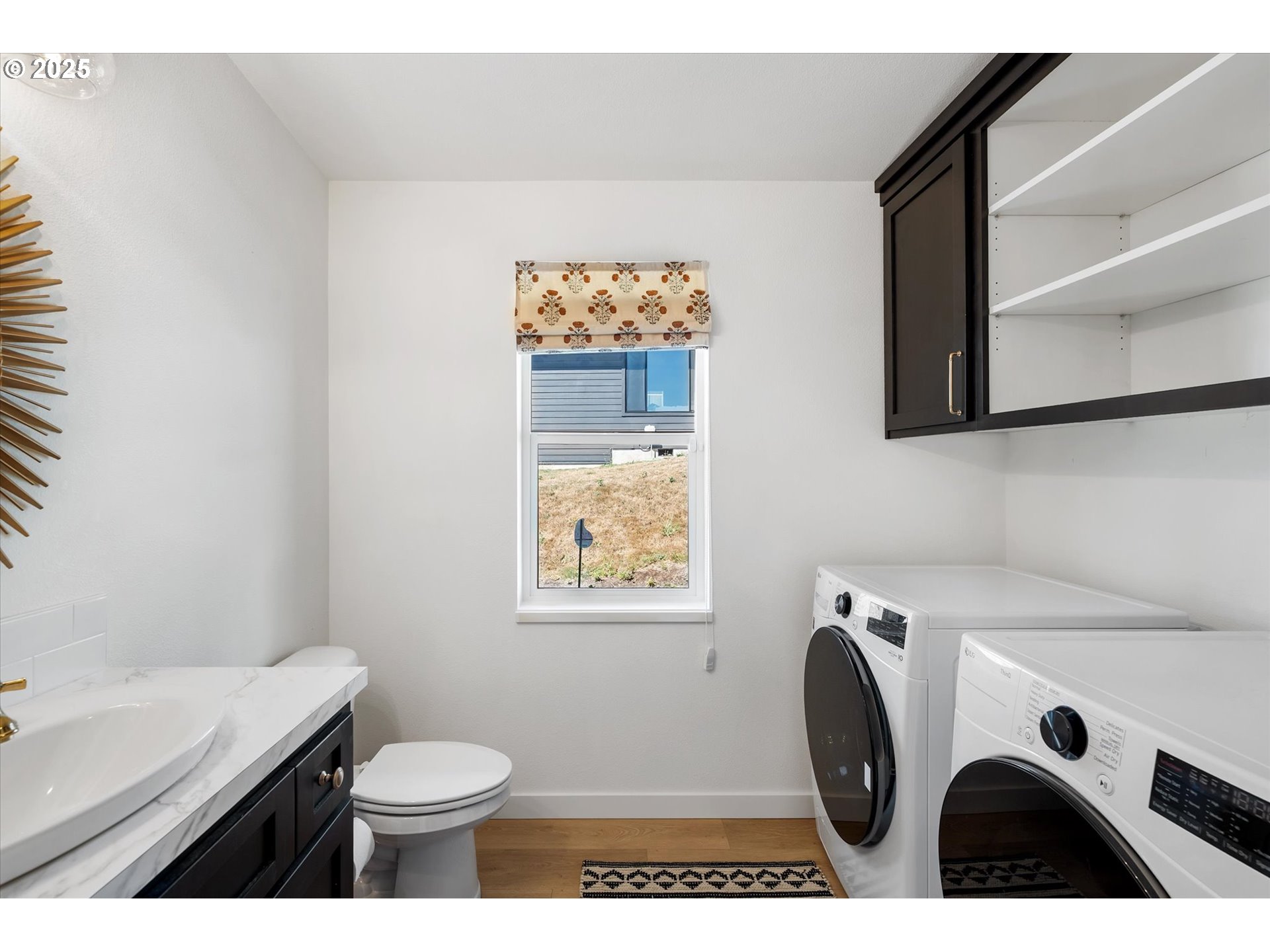 810 Taylor Road Kalama, WA 98625 - Photo 17 of 35 a bathroom with a sink a toilet and a mirror