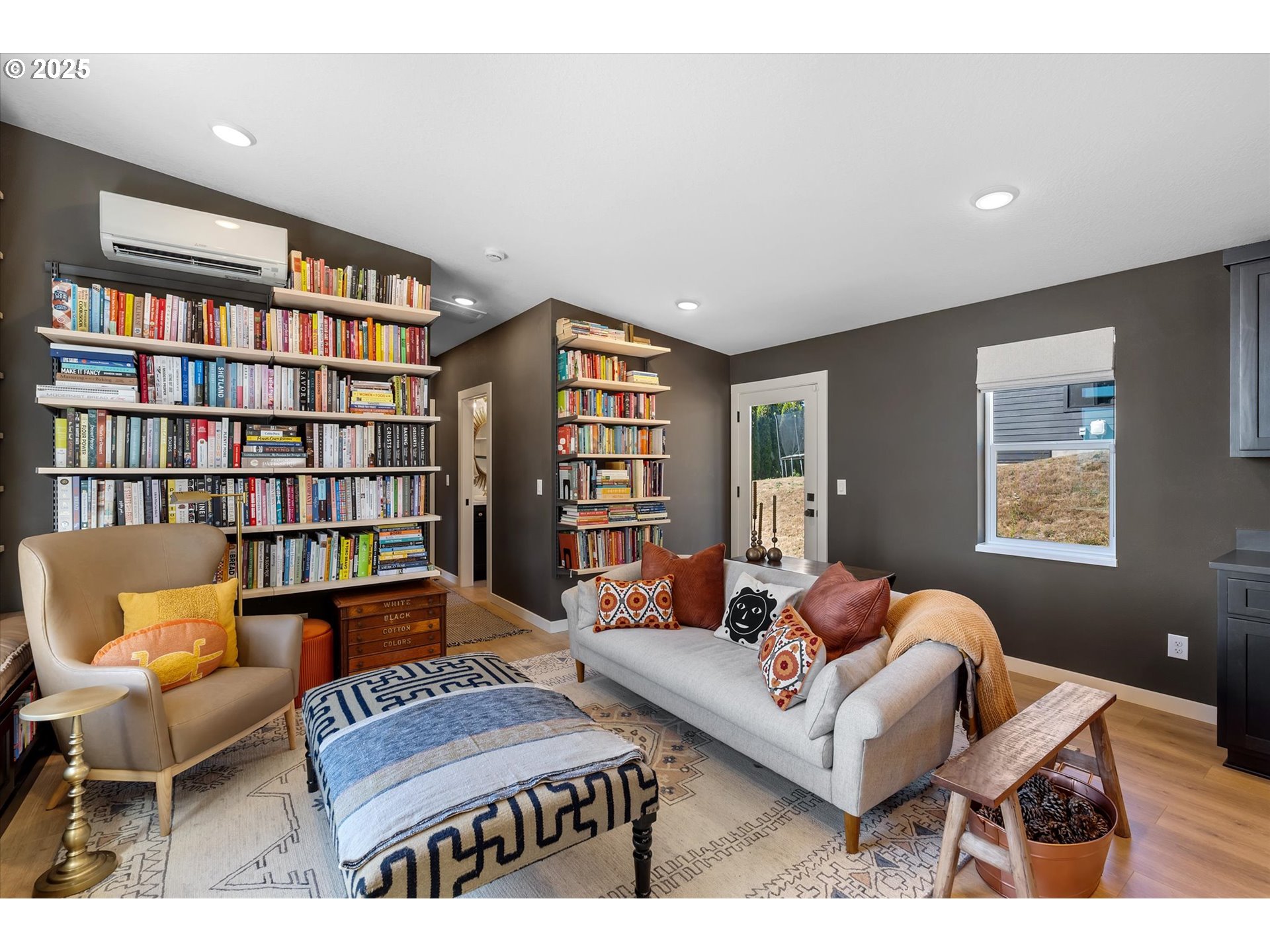 810 Taylor Road Kalama, WA 98625 - Photo 8 of 35 a living room with furniture and a book shelf