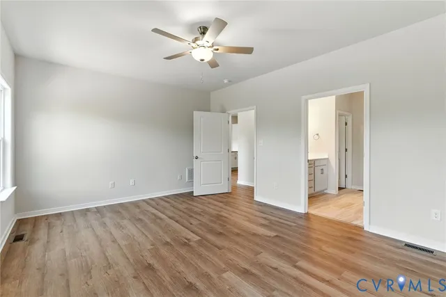 a bathroom with a double vanity sink a mirror and a shower