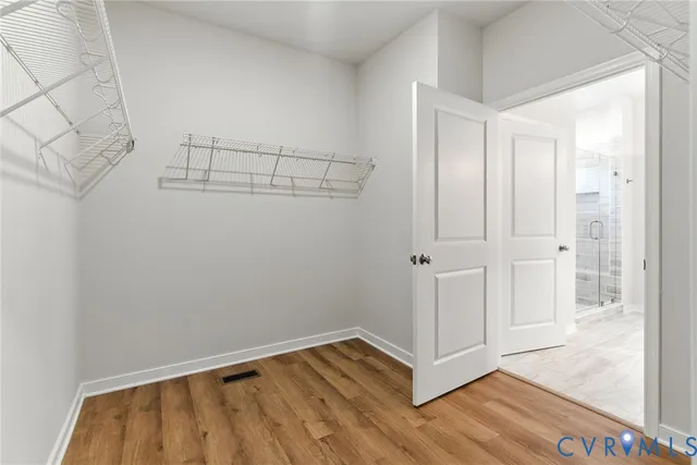 a backyard of a house with barbeque oven table and chairs
