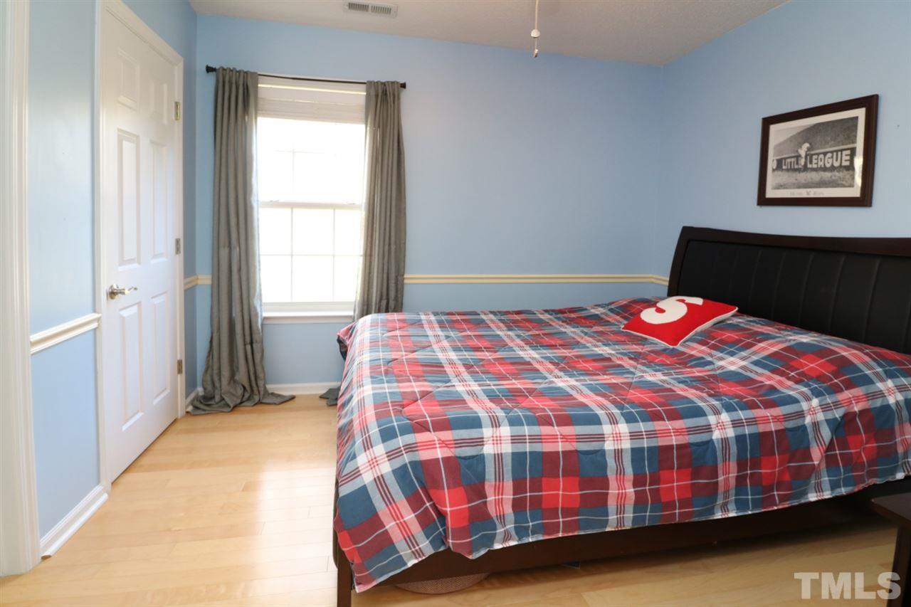4517 Drewbridge Way Raleigh, NC 27604 - Photo 17 of 30 a bedroom with a bed and a window