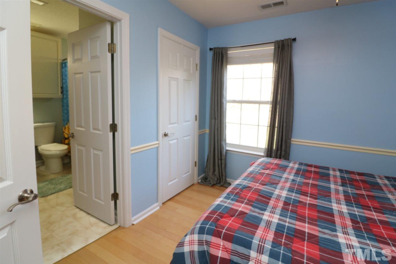 4517 Drewbridge Way Raleigh, NC 27604 - Photo 18 of 30 a bedroom with a bed and a window