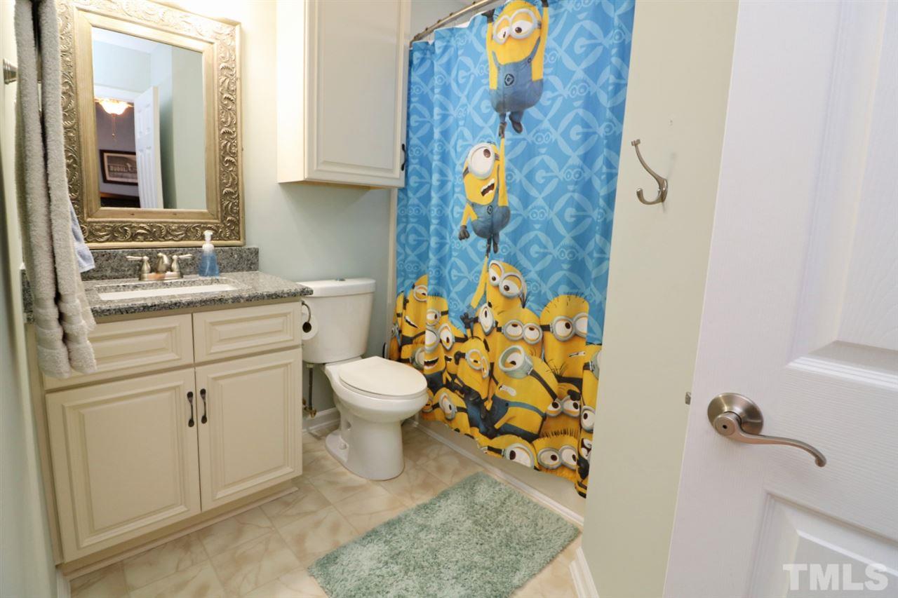 4517 Drewbridge Way Raleigh, NC 27604 - Photo 19 of 30 a bathroom with a toilet sink and mirror
