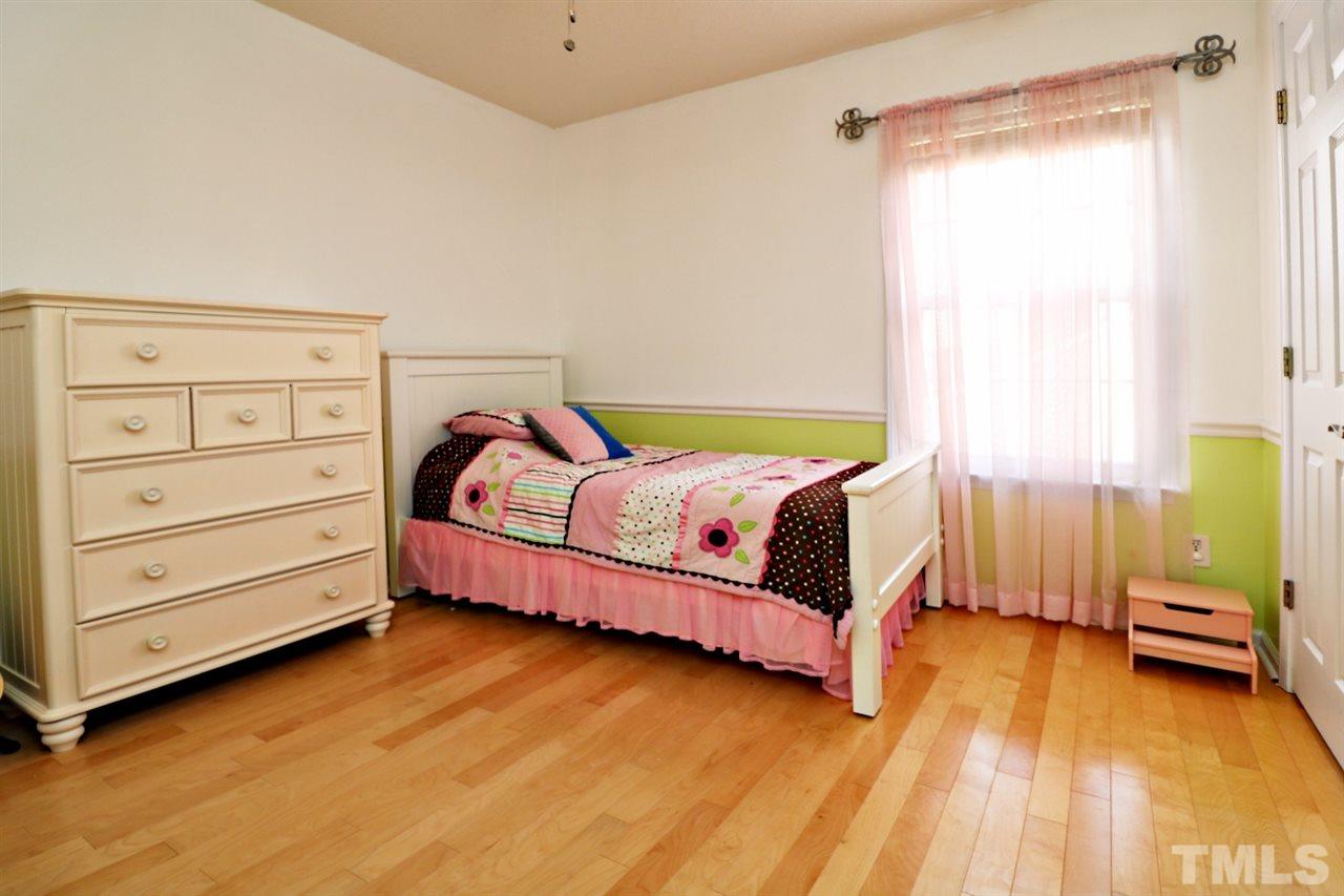 4517 Drewbridge Way Raleigh, NC 27604 - Photo 20 of 30 a bedroom with a bed and a window