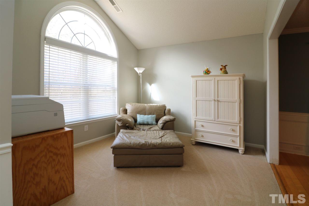 4517 Drewbridge Way Raleigh, NC 27604 - Photo 5 of 30 a living room with furniture and a large window