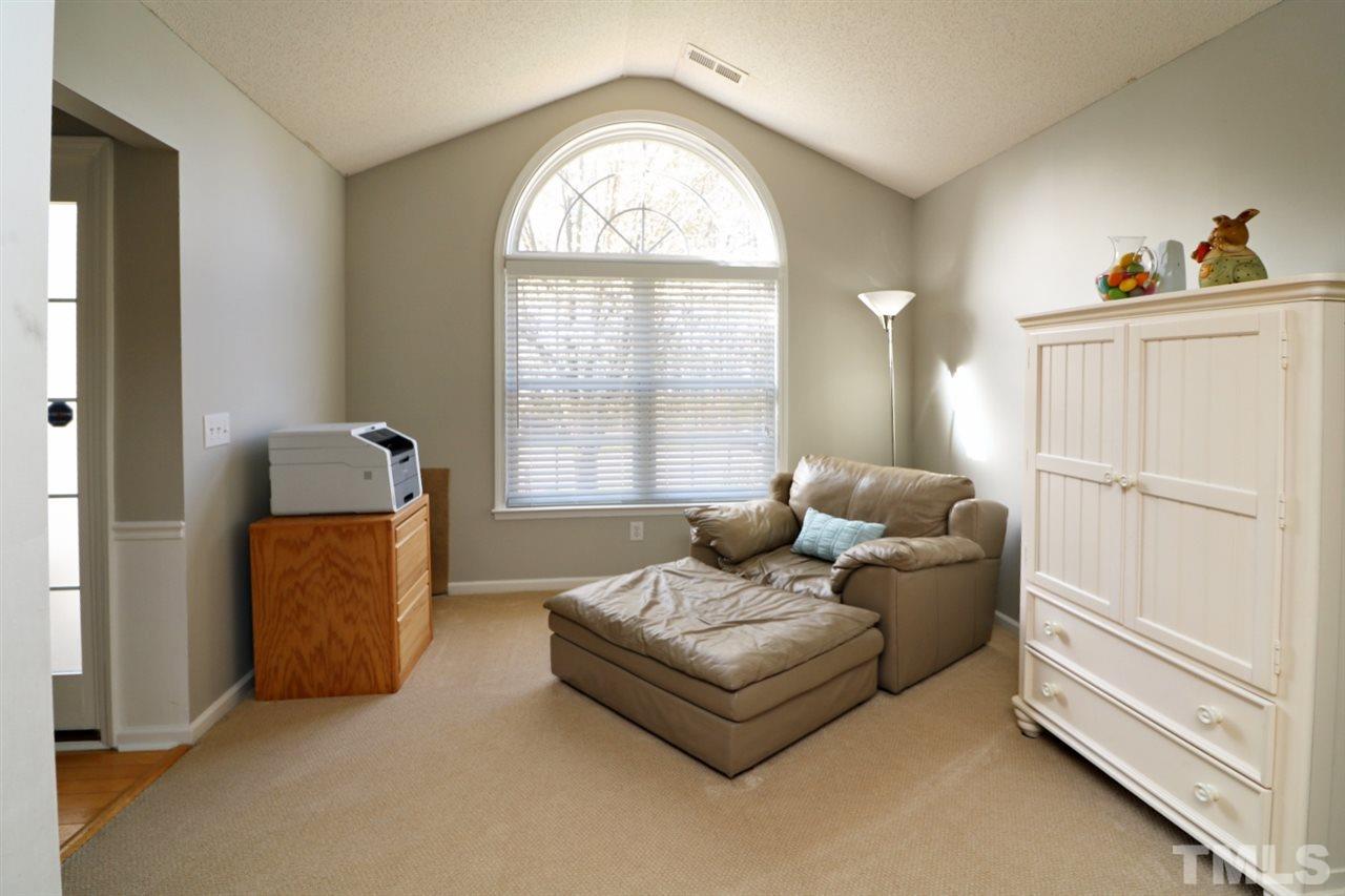 4517 Drewbridge Way Raleigh, NC 27604 - Photo 6 of 30 a living room with furniture and a window