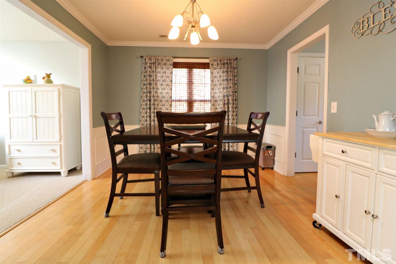 4517 Drewbridge Way Raleigh, NC 27604 - Photo 7 of 30 a view of a dining room with furniture and wooden floor