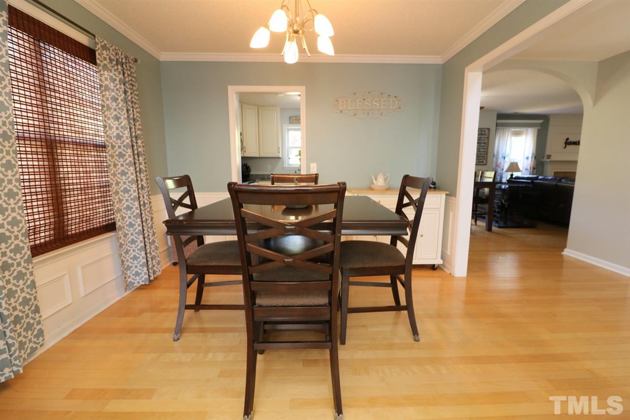 4517 Drewbridge Way Raleigh, NC 27604 - Photo 8 of 30 a dining room with furniture and wooden floor