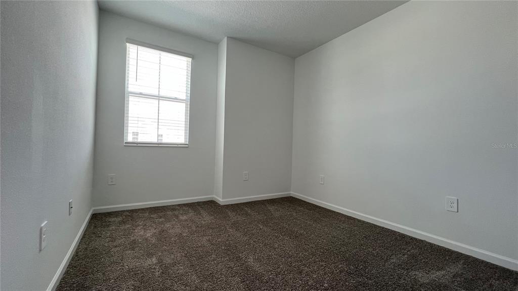 2396 Brook Marsh Loop Kissimmee, FL 34747 - Photo 17 of 29 an empty room with a window