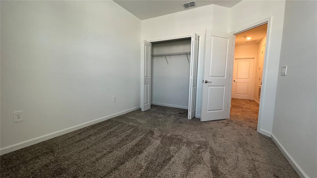 2396 Brook Marsh Loop Kissimmee, FL 34747 - Photo 18 of 29 an empty room with closet