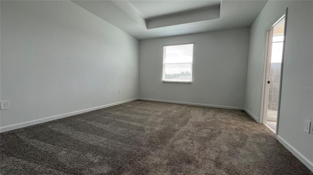 2396 Brook Marsh Loop Kissimmee, FL 34747 - Photo 21 of 29 an empty room with a window