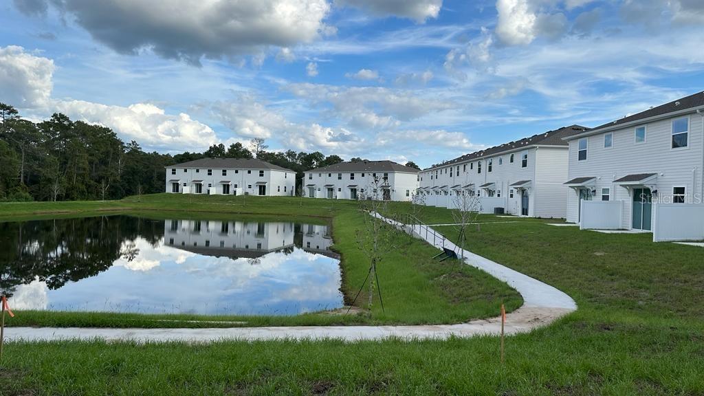 2396 Brook Marsh Loop Kissimmee, FL 34747 - Photo 29 of 29 a view of a swimming pool with a yard