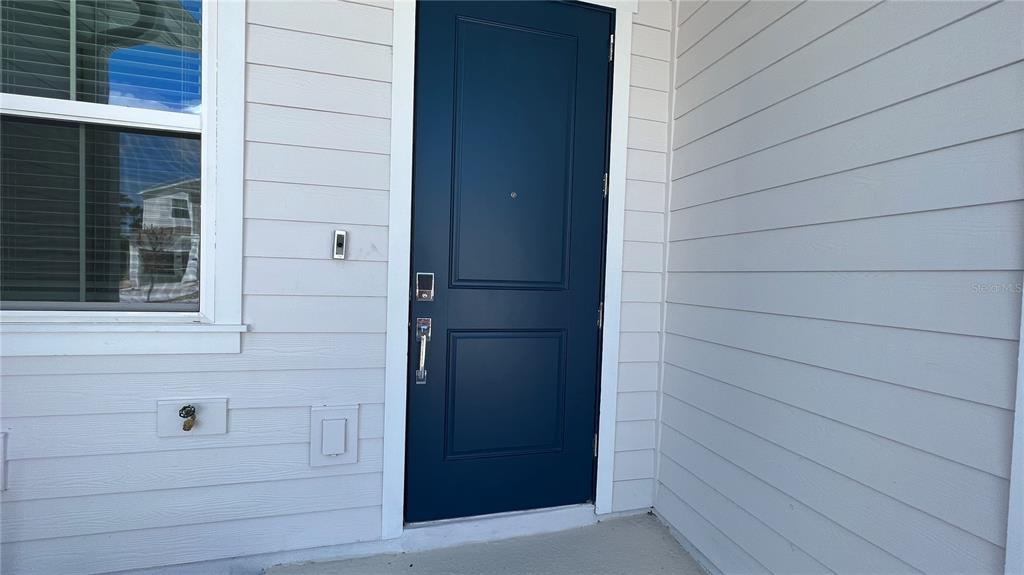 2396 Brook Marsh Loop Kissimmee, FL 34747 - Photo 3 of 29 a view of door