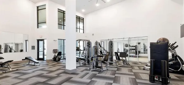 a living room with furniture and a glass door