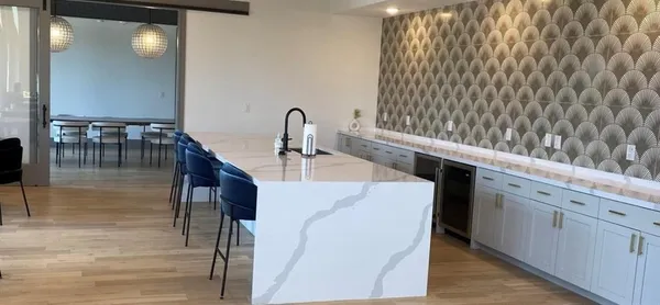 a kitchen with stainless steel appliances a sink and a refrigerator