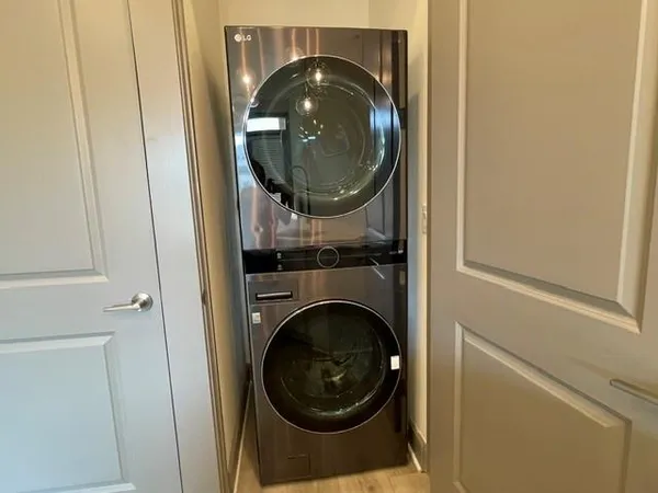 a close view of a utility room with washer and dryer