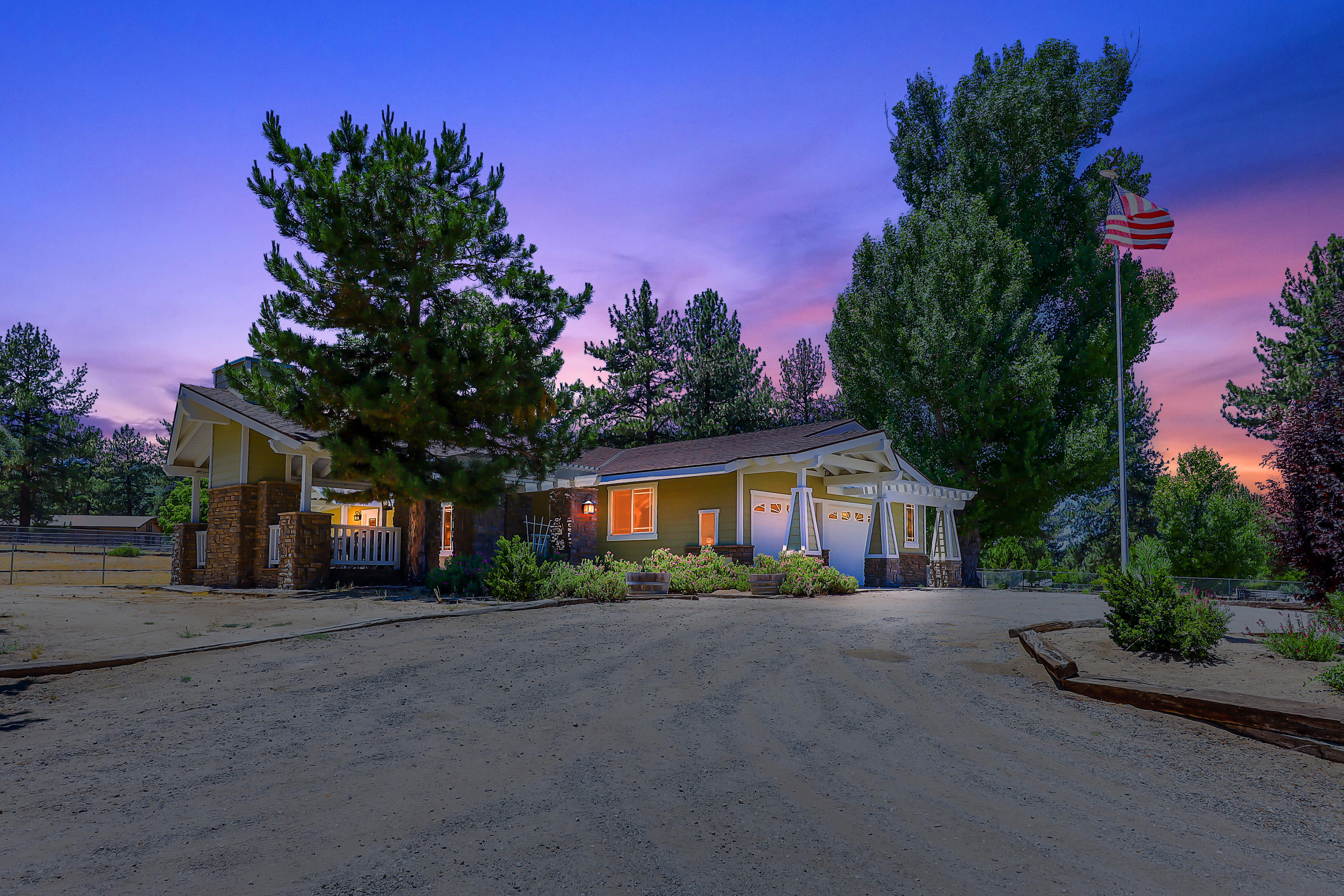 36211 Tool Box Spring Road Mountain Center, CA 92561 - Photo 1 of 26 a front view of a house with a yard and garage