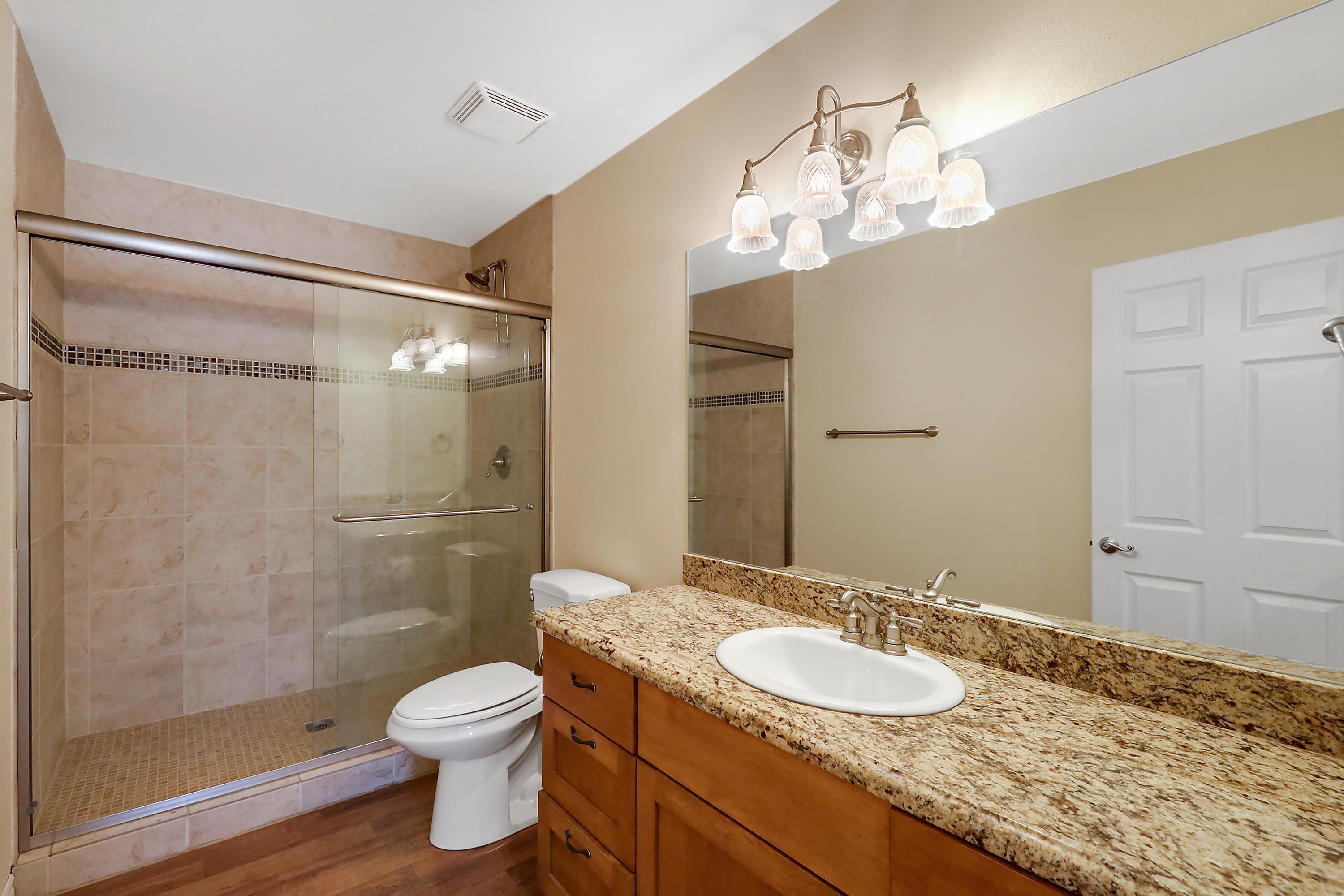36211 Tool Box Spring Road Mountain Center, CA 92561 - Photo 13 of 26 a bathroom with a granite countertop sink toilet a mirror and shower