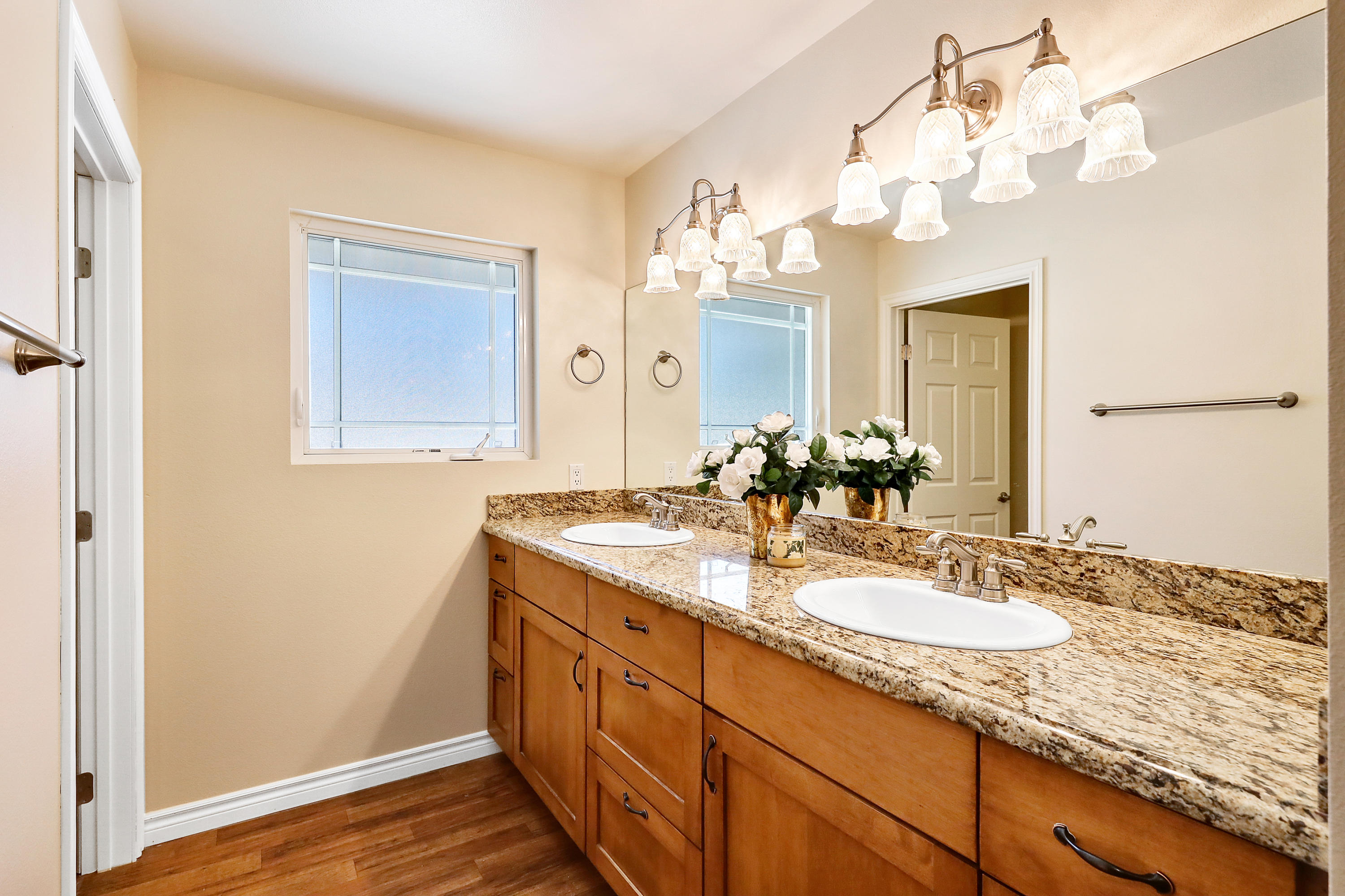 36211 Tool Box Spring Road Mountain Center, CA 92561 - Photo 18 of 26 a bathroom with a granite countertop double vanity sink and a mirror