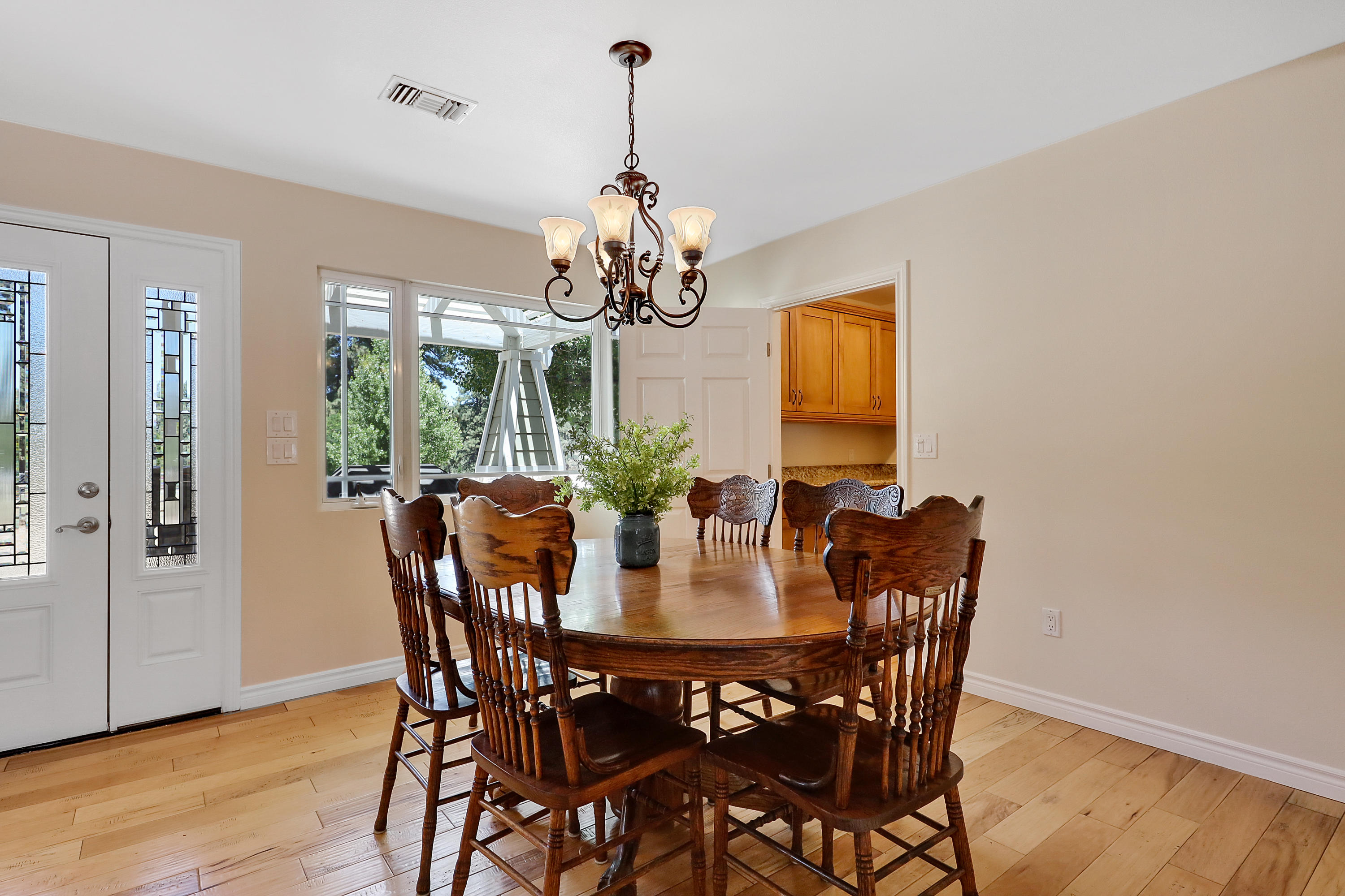 36211 Tool Box Spring Road Mountain Center, CA 92561 - Photo 9 of 26 a view of a dining room with furniture window and wooden floor
