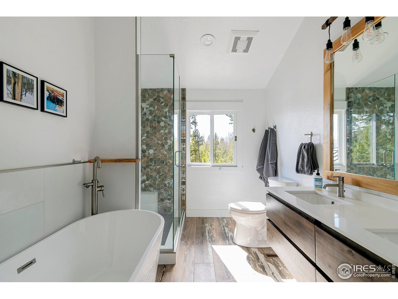 61 County Road 8501 Tabernash, CO 80478 - Photo 26 of 38 Primary bathroom with large soaking tub, separate shower and double vanity and heated floors