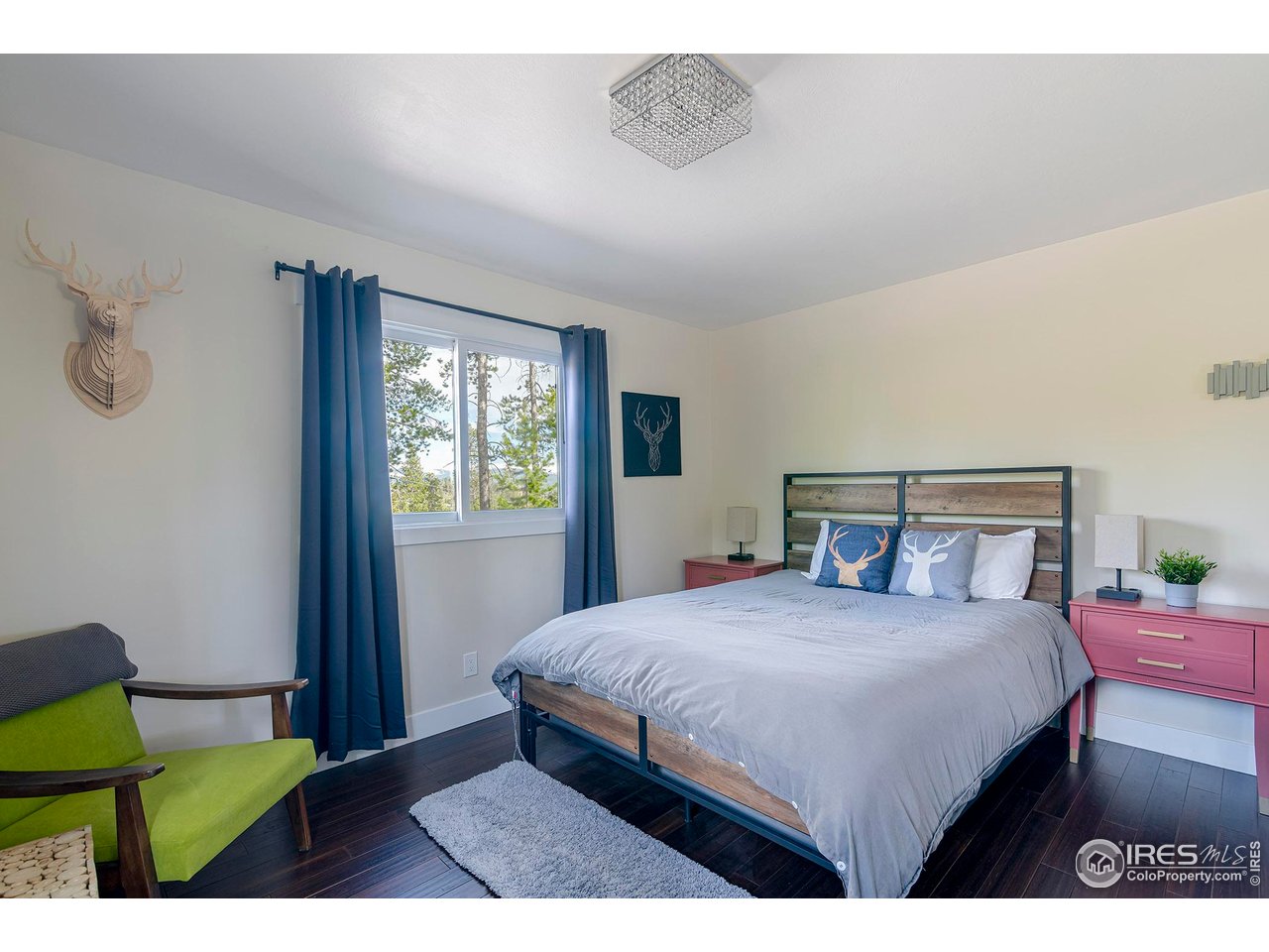 61 County Road 8501 Tabernash, CO 80478 - Photo 27 of 38 Bedroom 2 on the main level with hardwood floors