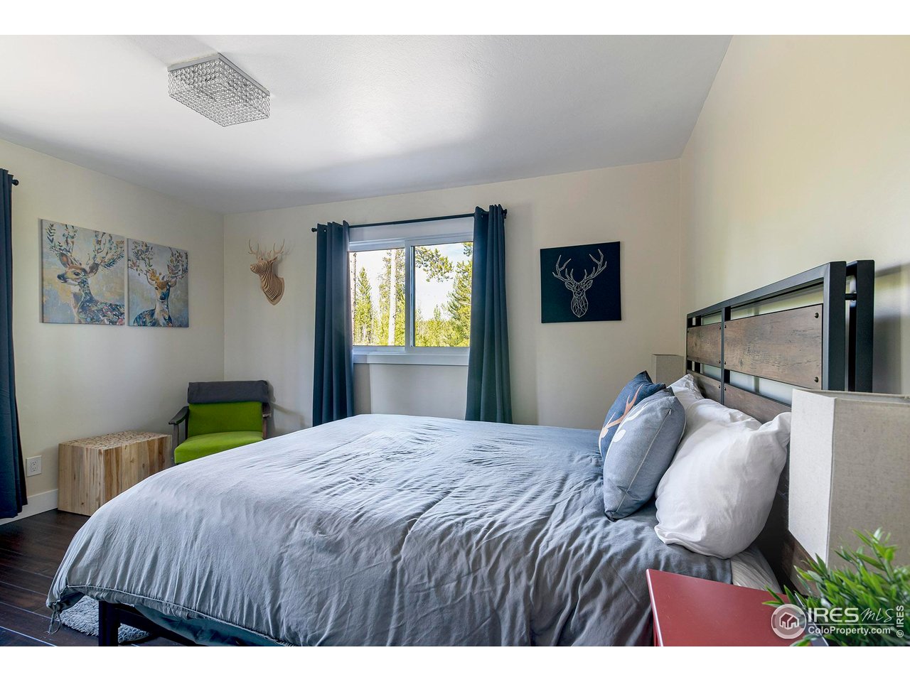 61 County Road 8501 Tabernash, CO 80478 - Photo 28 of 38 Bedroom 2 on the main level with hardwood floors