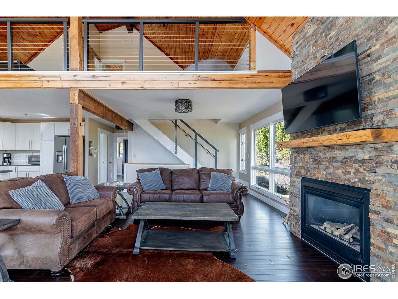 61 County Road 8501 Tabernash, CO 80478 - Photo 10 of 38 Gas fireplace with stacked stone