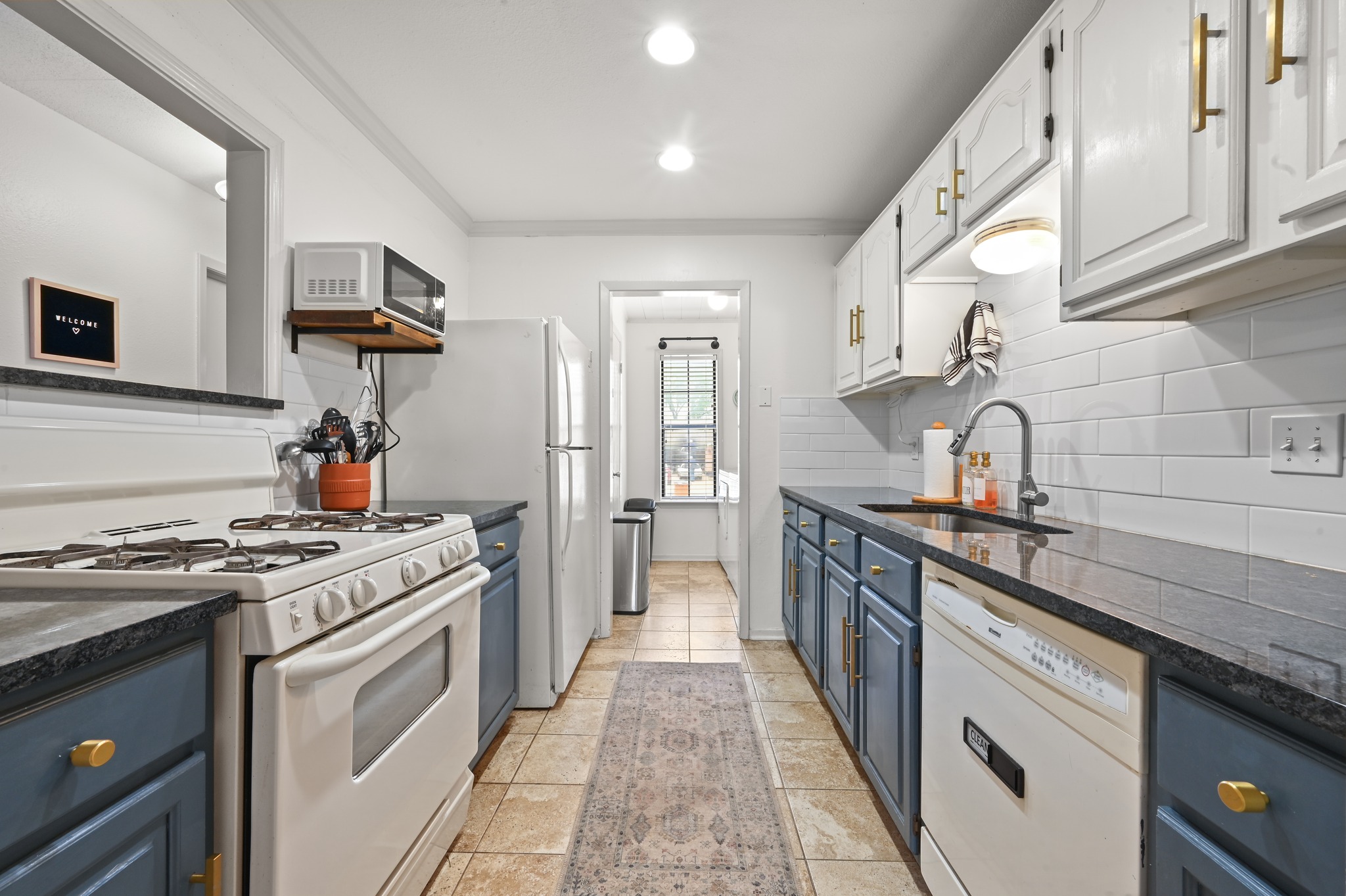 6805 Rearden Road Austin, TX 78745 - Photo 8 of 26 A well-appointed galley kitchen offers ample counter space and abundant storage for culinary pursuits.