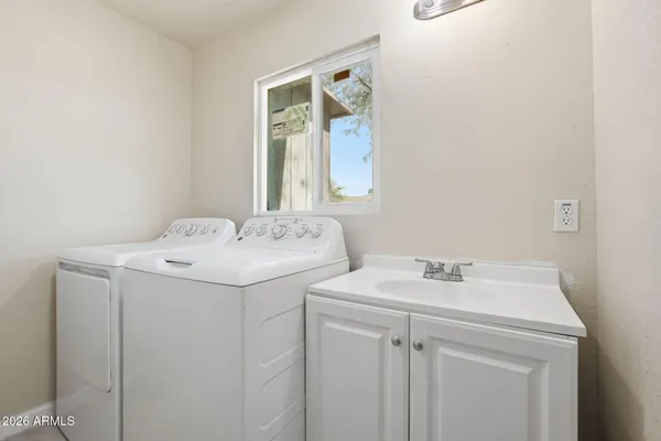 a utility room with dryer and washer