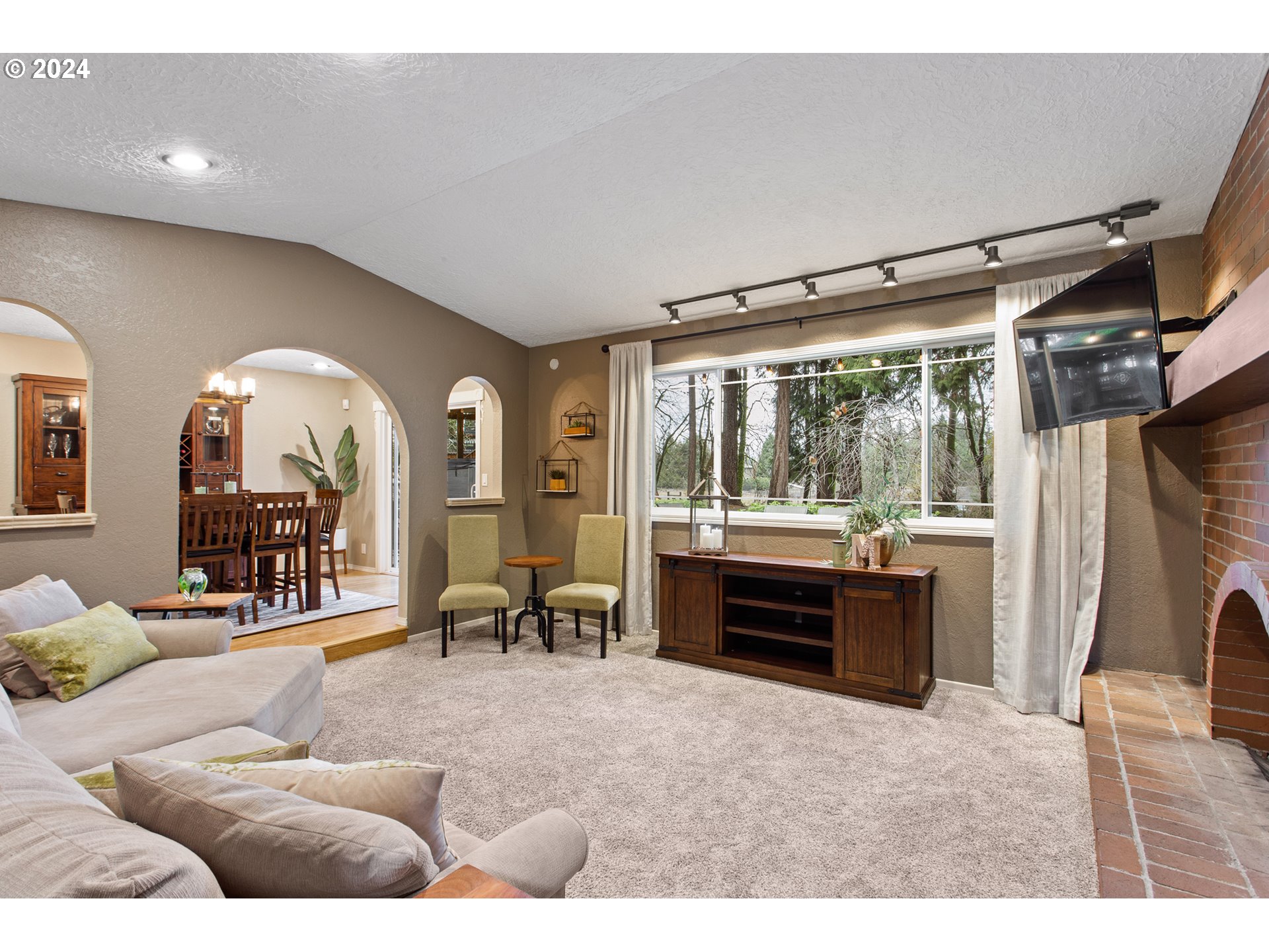 3308 Northwest 203rd Street Ridgefield, WA 98642 - Photo 18 of 41 a living room with furniture and a large window