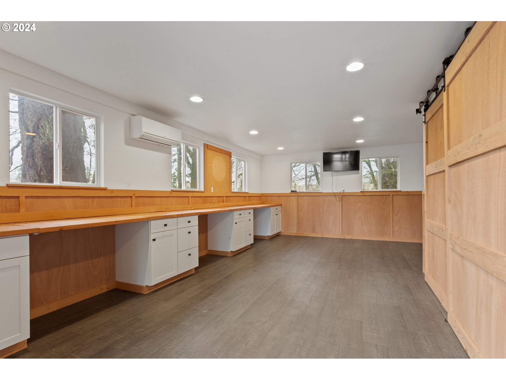 3308 Northwest 203rd Street Ridgefield, WA 98642 - Photo 28 of 41 a view of a kitchen with kitchen island wooden floors and stainless steel appliances