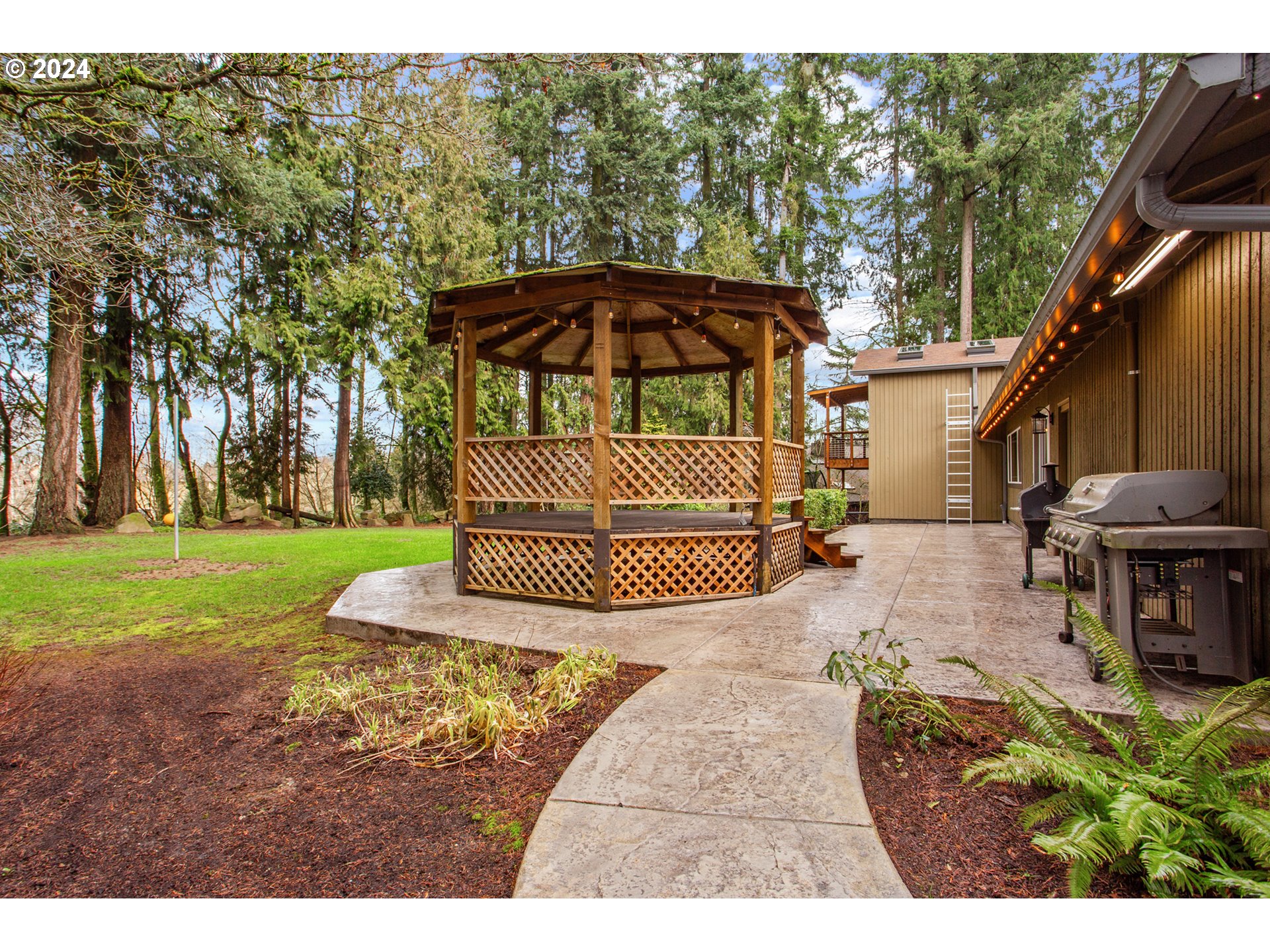 3308 Northwest 203rd Street Ridgefield, WA 98642 - Photo 29 of 41 a view of a house with backyard and sitting area